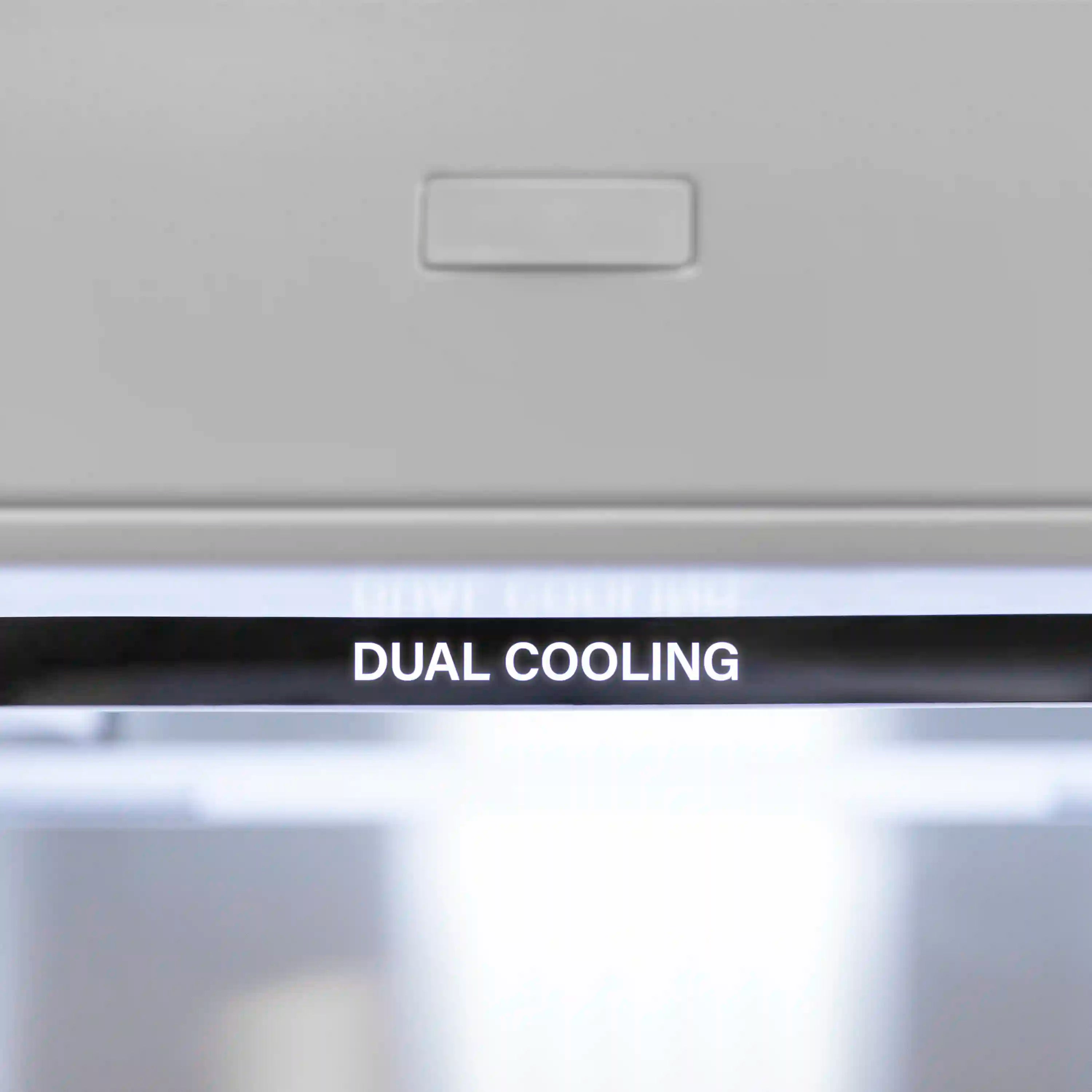 Bottom freezer refrigerator dual cooling air vent panel