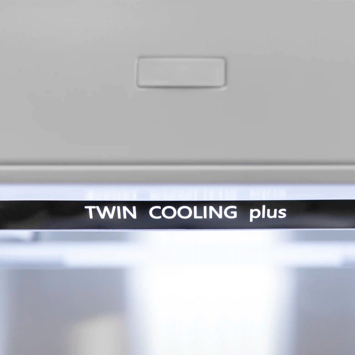 Refrigerator front display showing "TWIN COOLING plus"