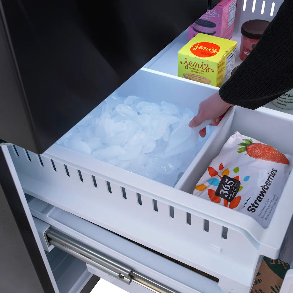 Refrigerator freezer drawer with ice bin and food items in clear storage bins