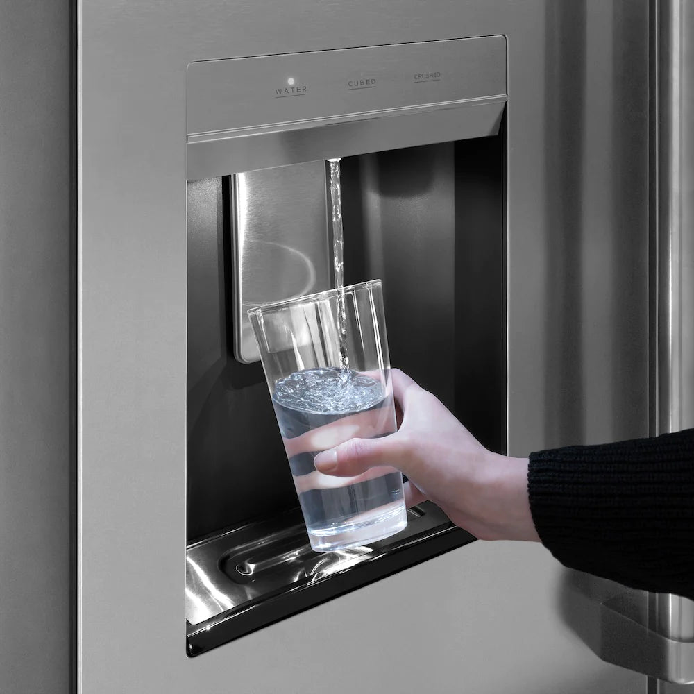 External water dispenser dispensing a clear glass of water from refrigerator