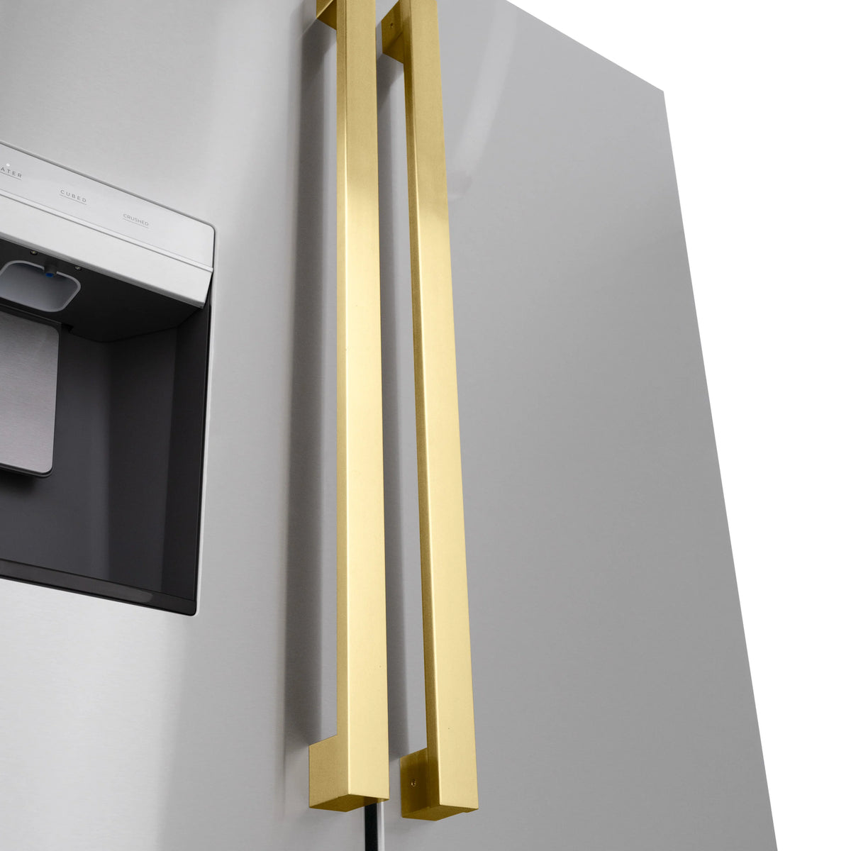 Polished gold long bar refrigerator handles mounted on a cabinet door