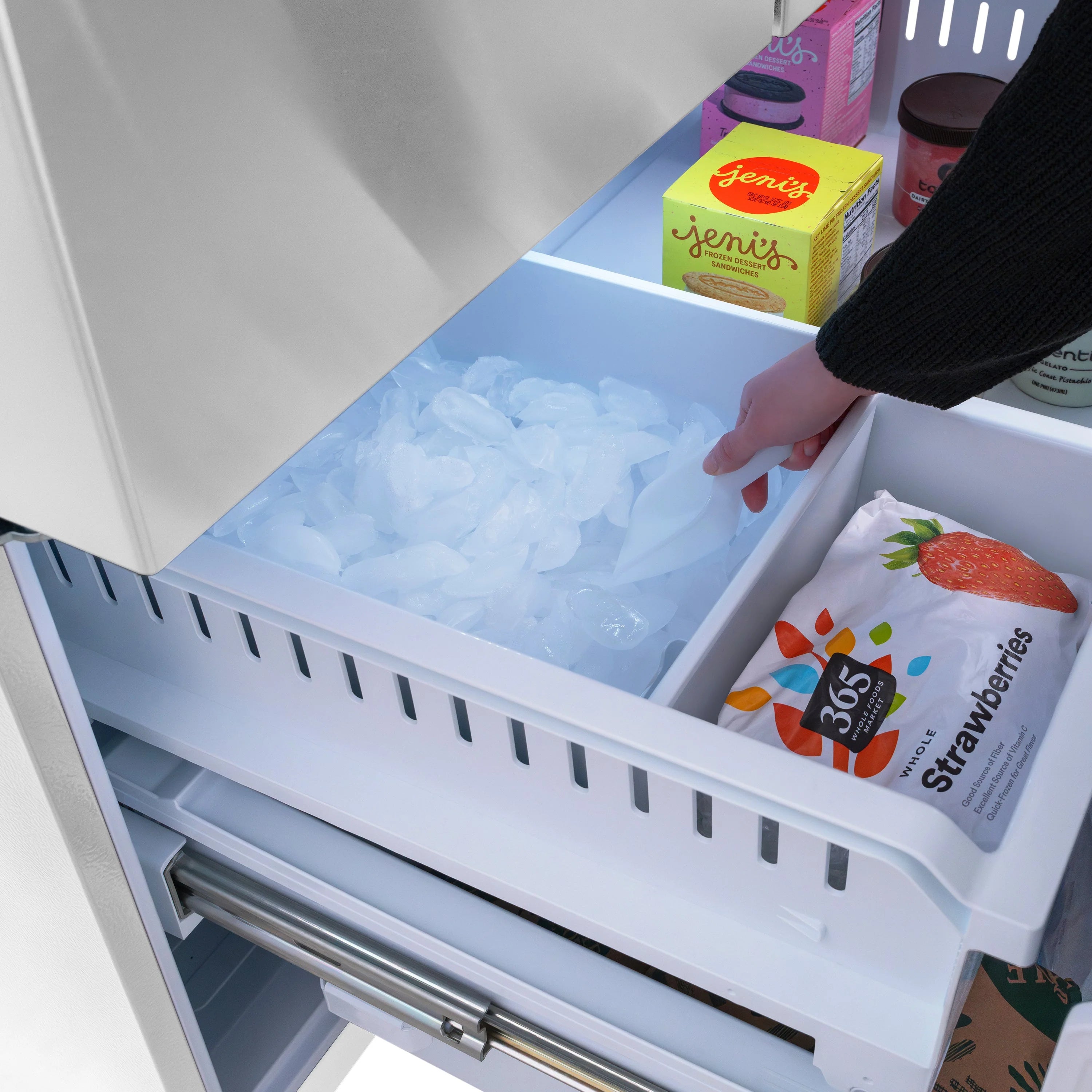 Ice drawer with ice pile and open tray for dispensing