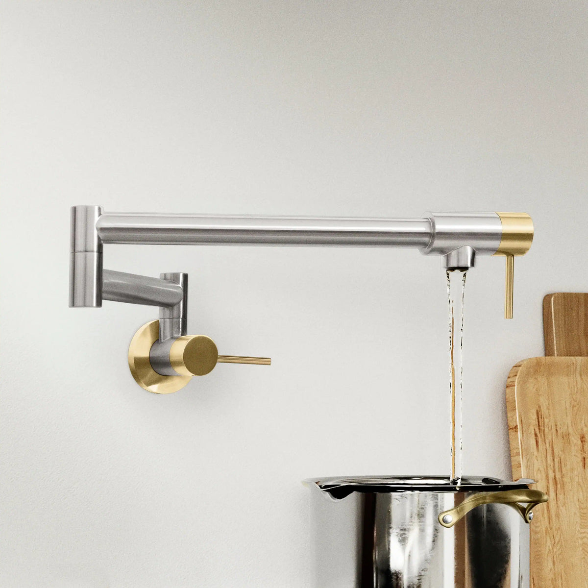 Wall-mounted Gemini pot filler with brushed nickel pipes and champagne bronze spout