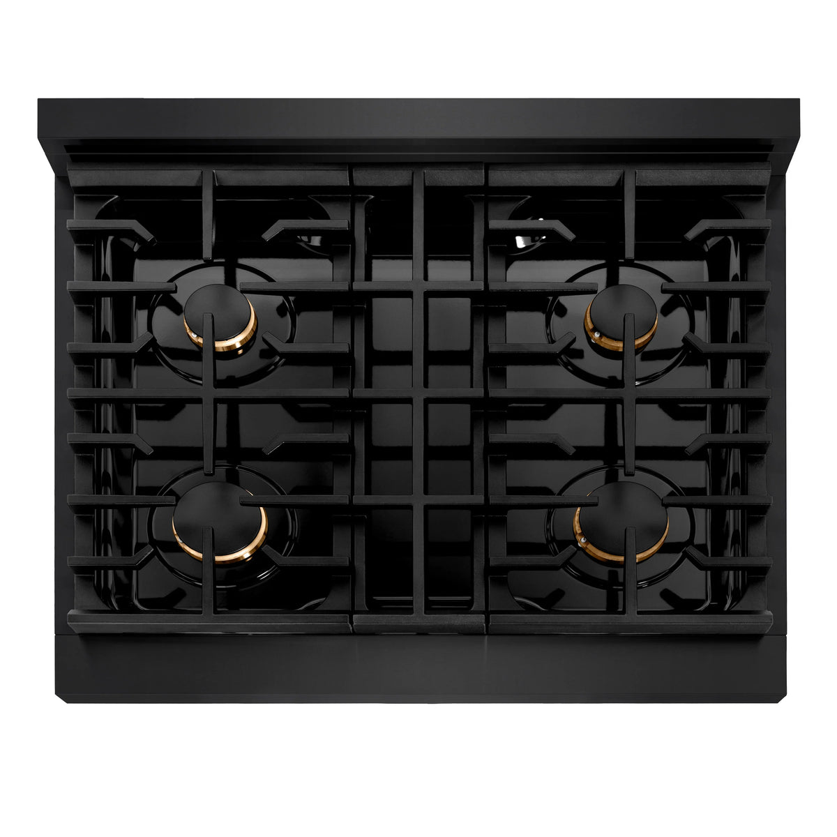 Black gas cooktop with four burners, gold trim caps, and cast grates top view