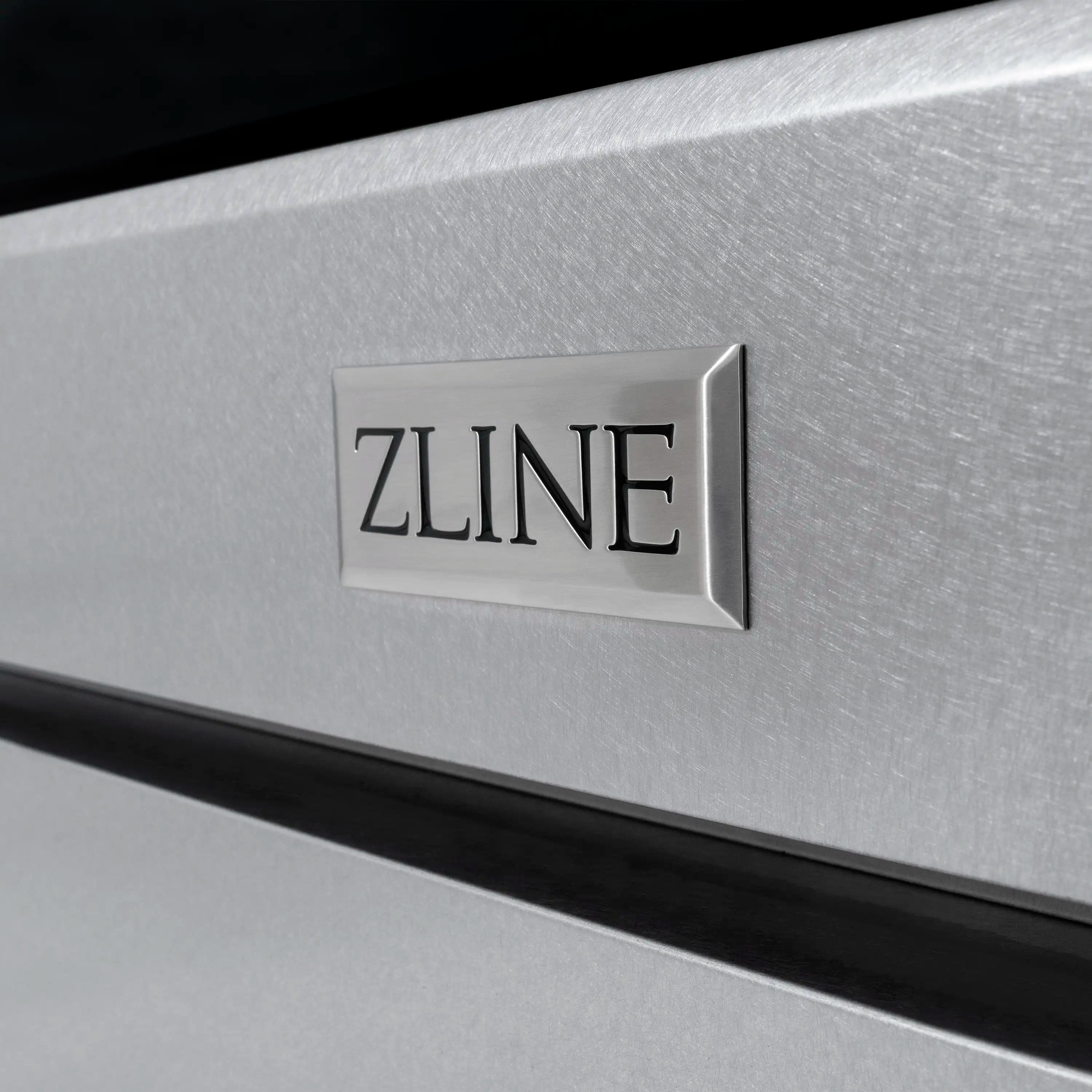 ZLINE logo plate on satin stainless steel dual fuel range door