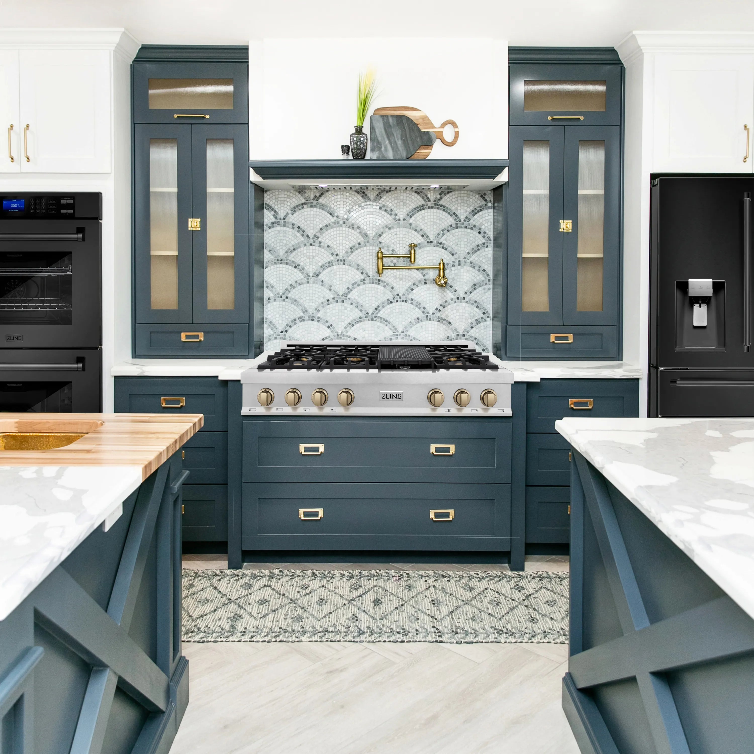Stainless steel 7-burner gas cooktop with bronze control knobs, built into cabinetry