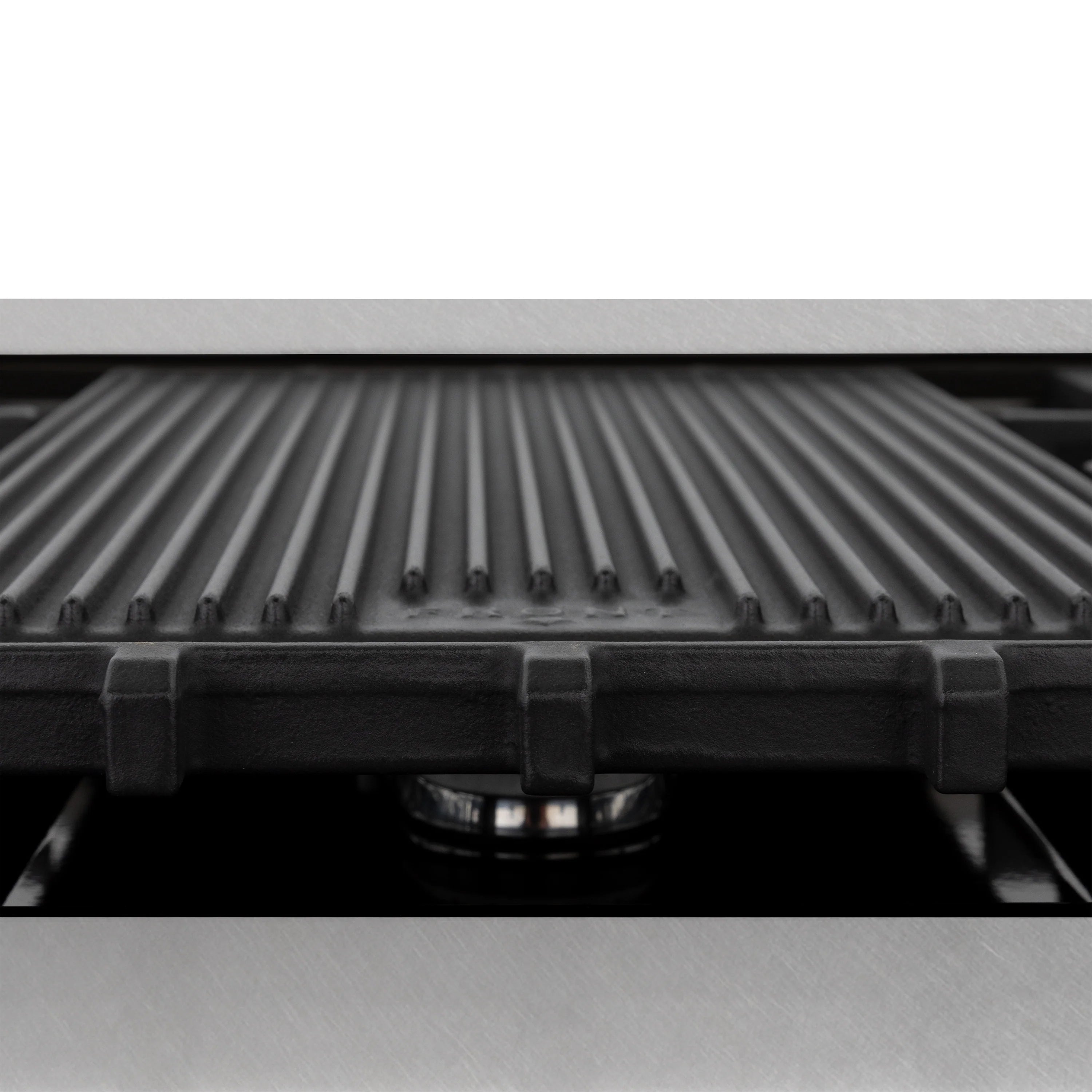 Ribbed oven element panel inside the cooking cavity beneath the stovetop