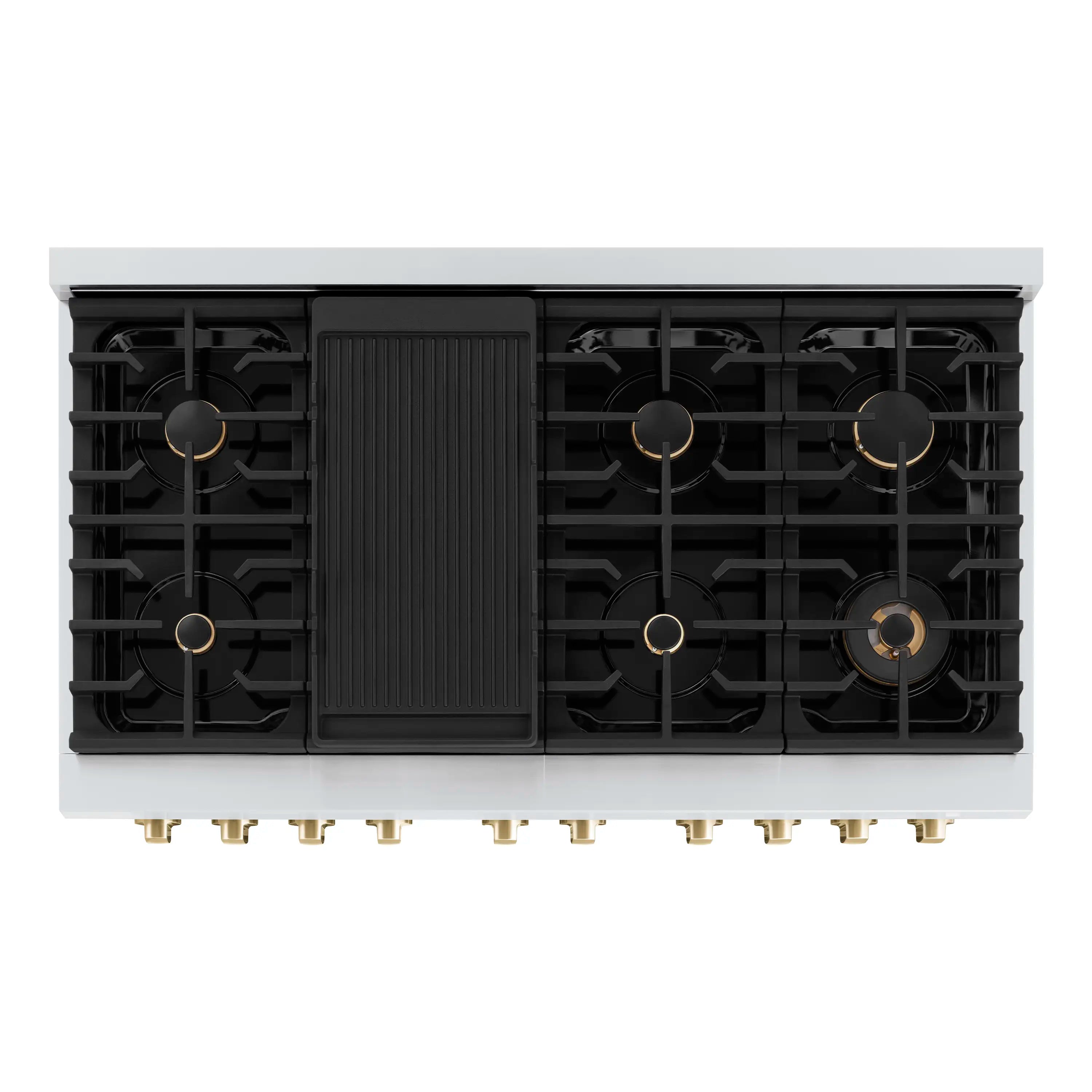Underside view of cooktop with black burner grate sections and gold burner caps