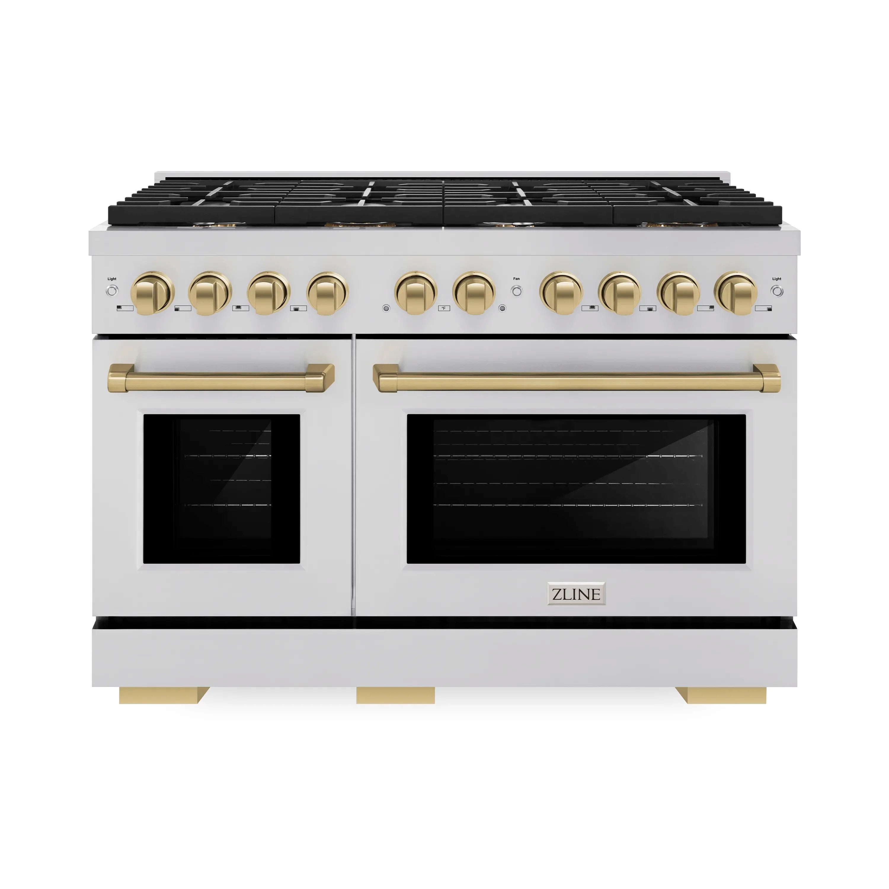 Dual fuel range with two ovens, black cooktop, and champagne bronze control knobs