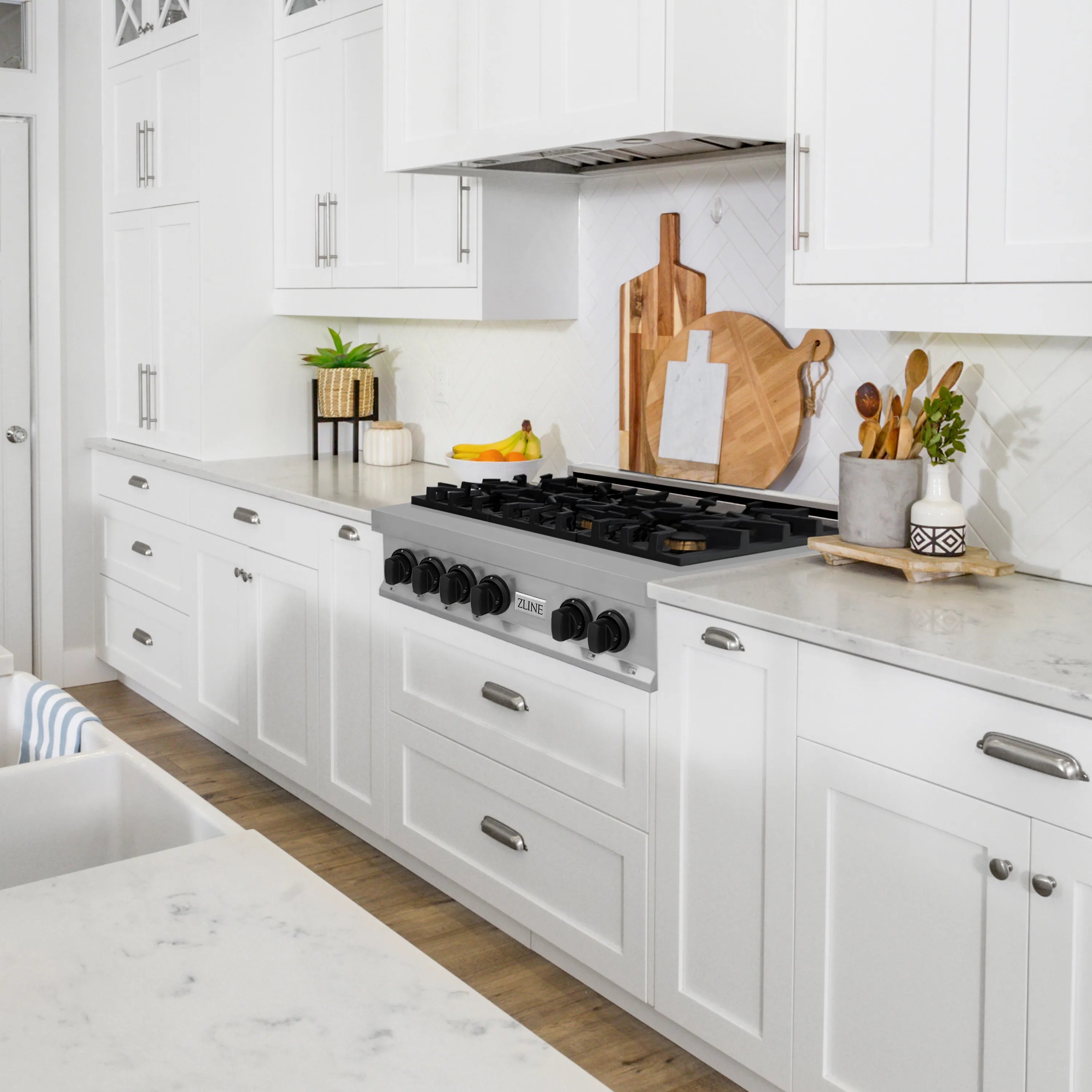 Stainless steel 6-burner gas rangetop with black grates and burner controls