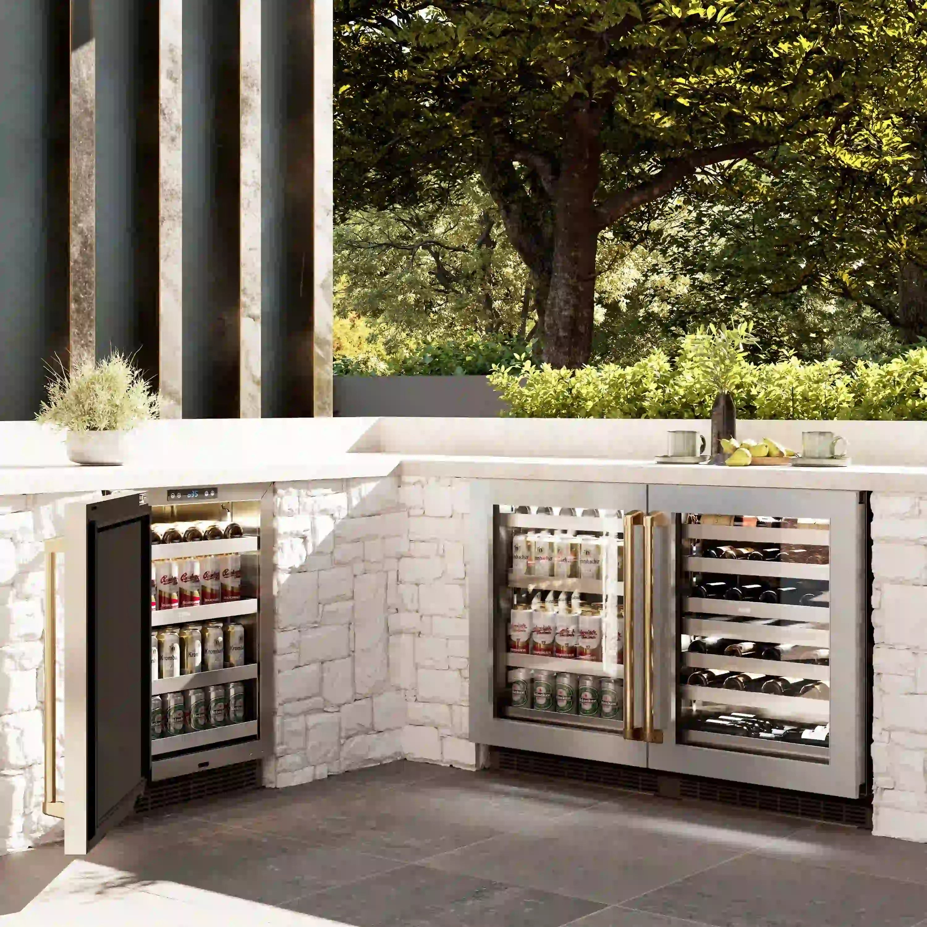 Built-in beverage fridge with two glass doors, gold handle, and stocked interior shelves