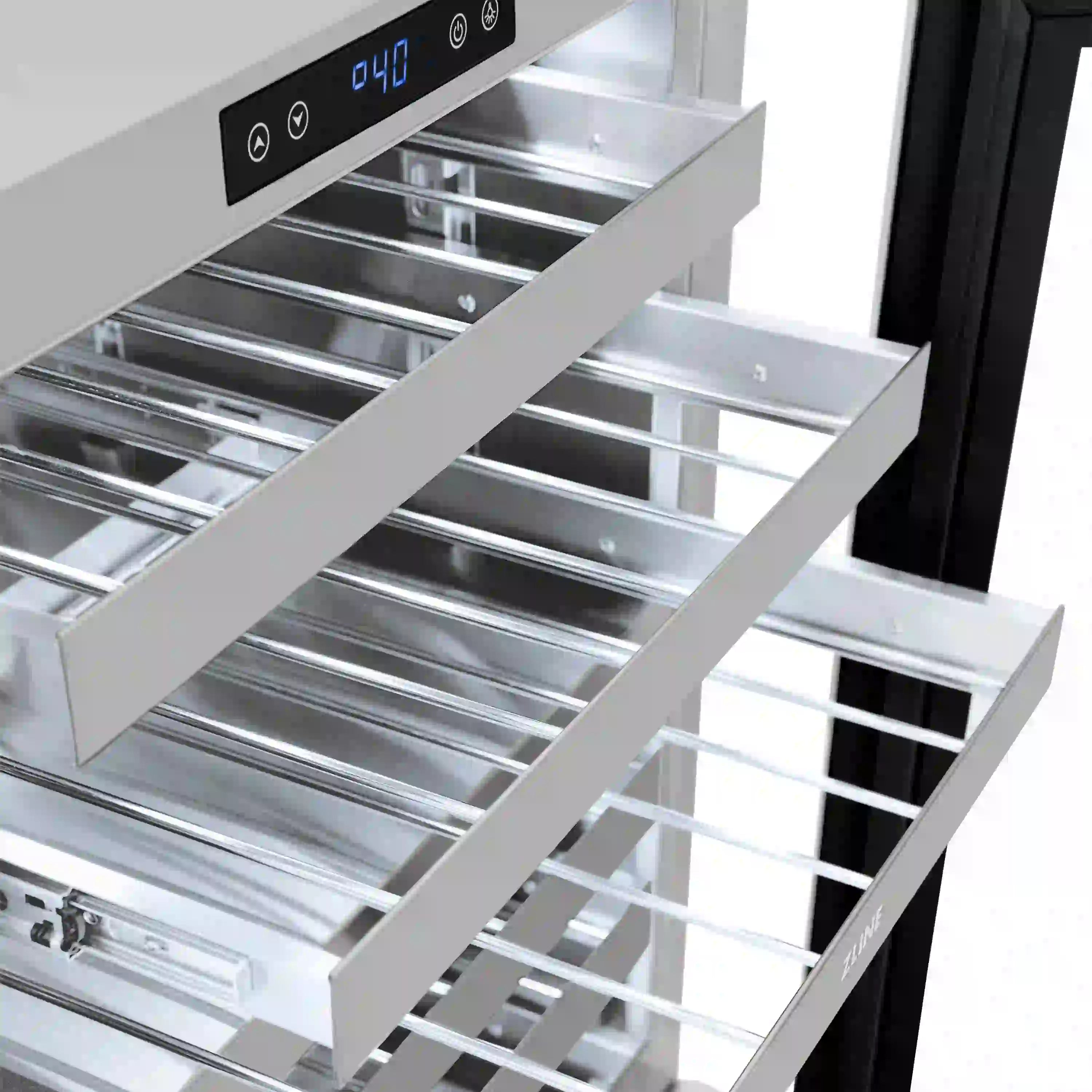 Dual-zone wine cooler interior with chrome racks and black-framed glass door open