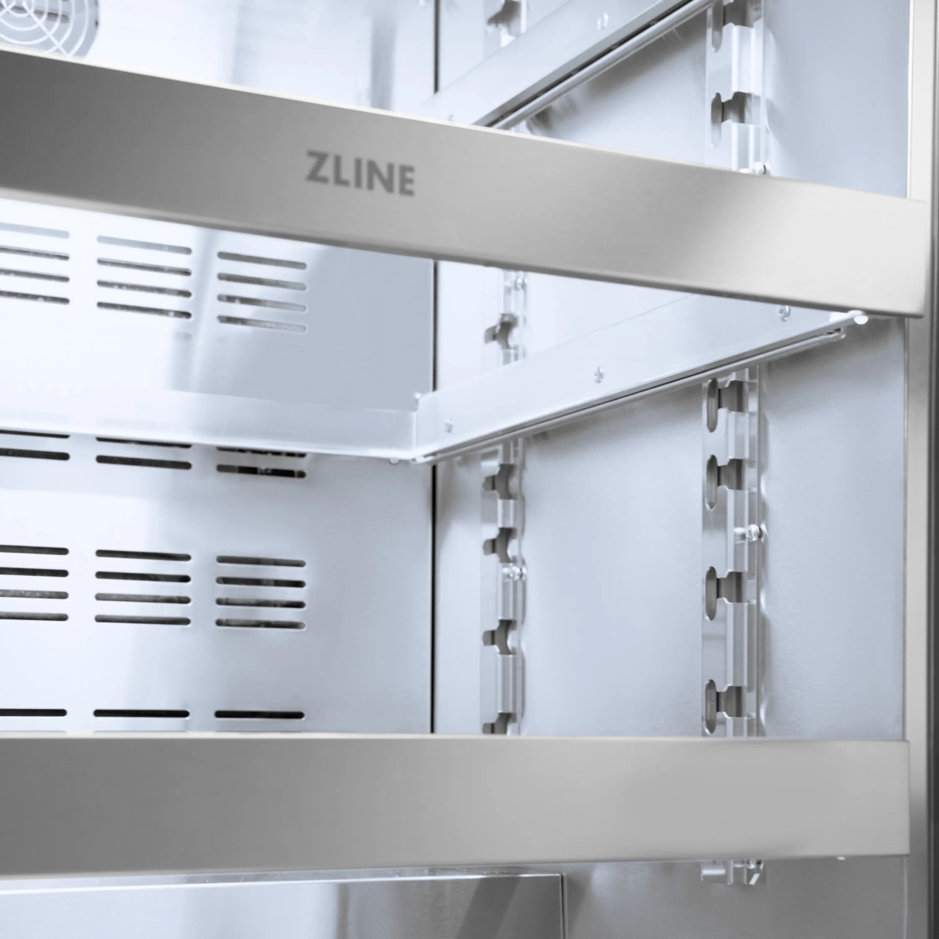 Stainless beverage fridge interior side panel with ZLINE label and adjustable hardware