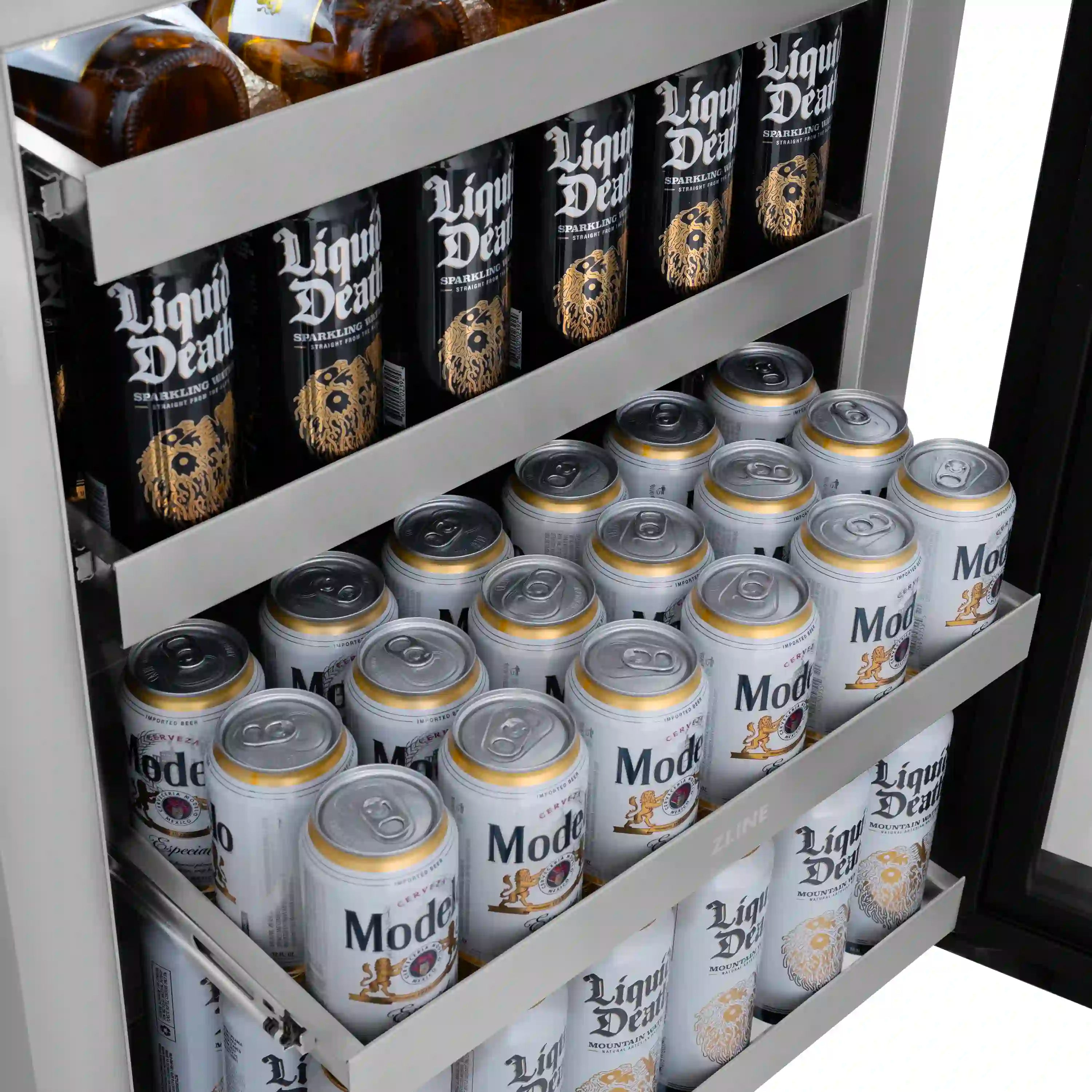 Beverage fridge interior shelves stocked with cans in neat rows