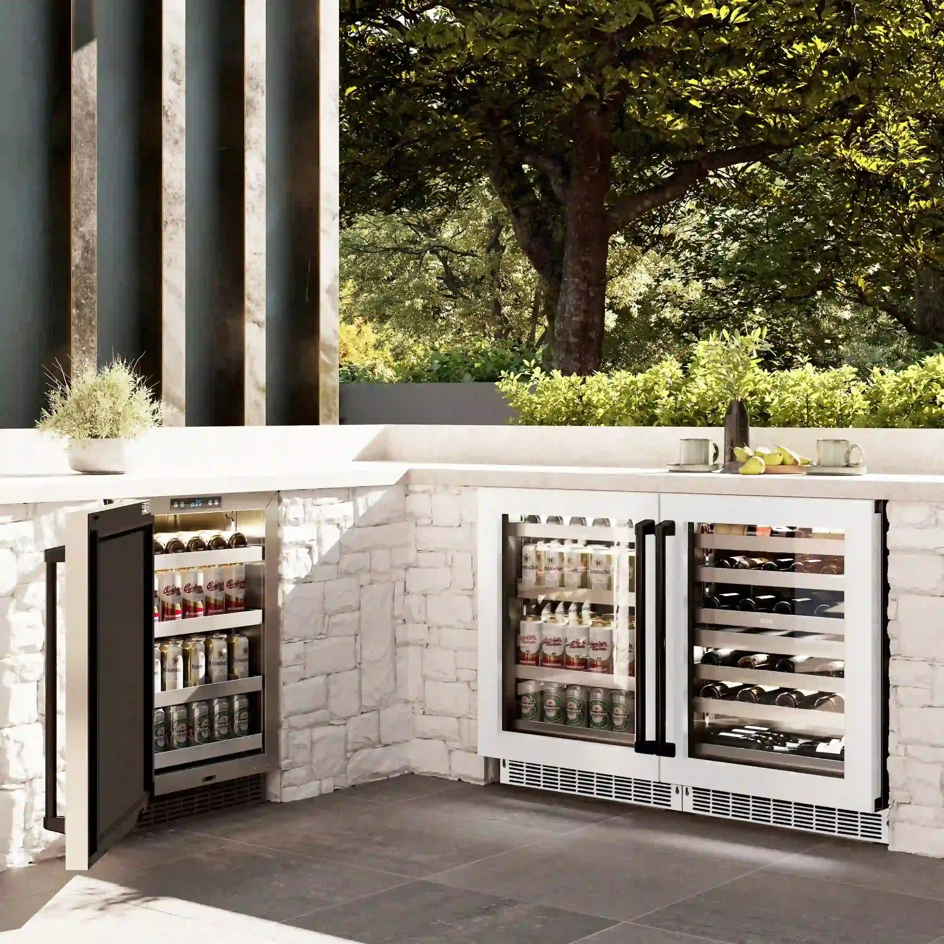 Outdoor built-in beverage center with two open doors and stocked bottle shelves.