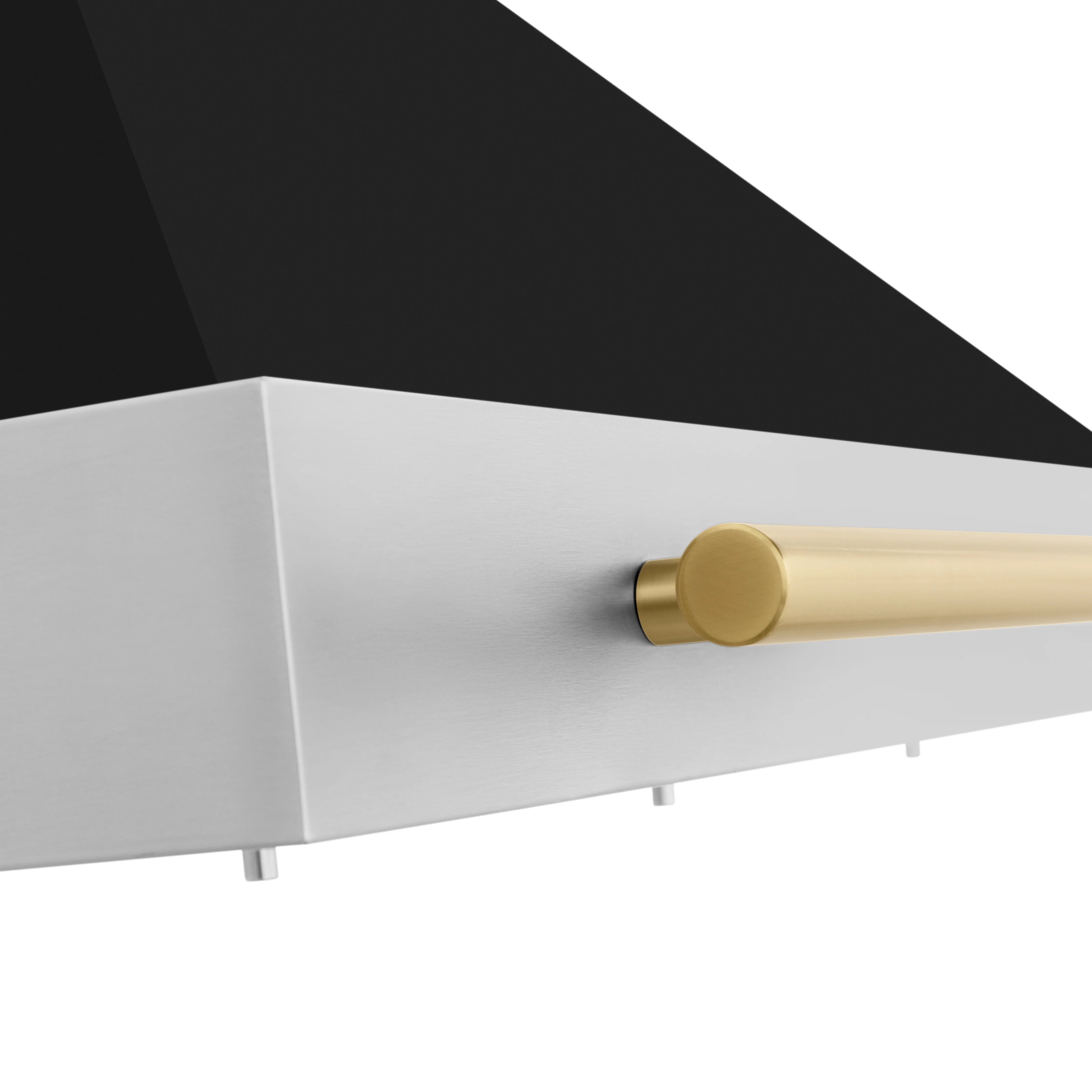 Side view of range hood with matte gold handle on black and white front panel