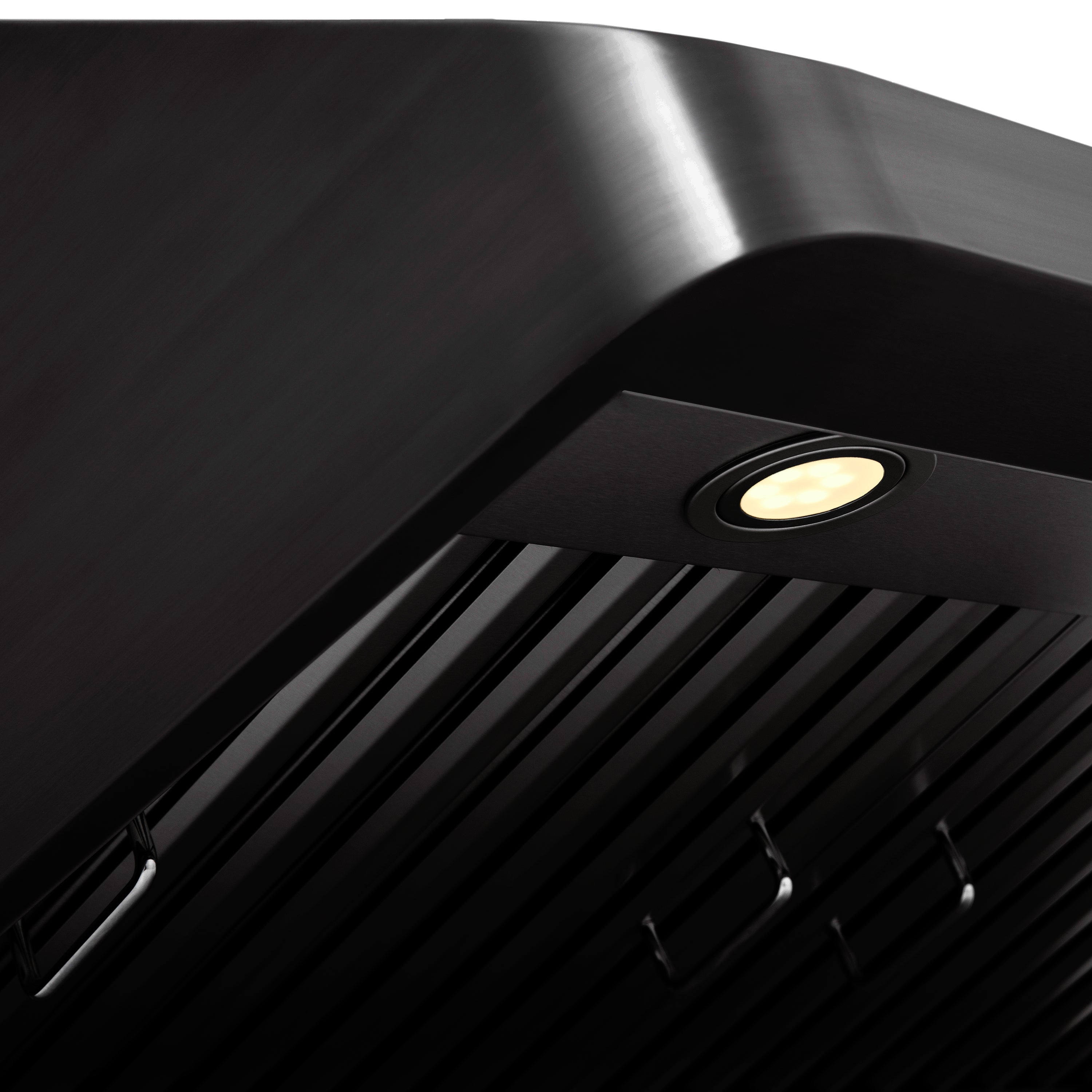 Black under-cabinet range hood with recessed spotlight and vent grille detail.