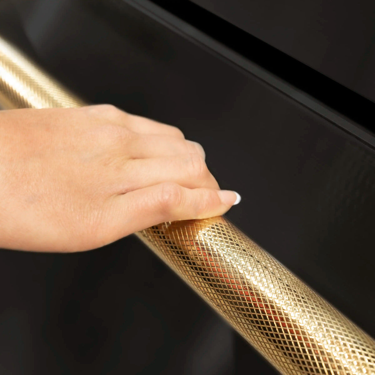 Counter-depth refrigerator gold helix handle with fingertips pulling