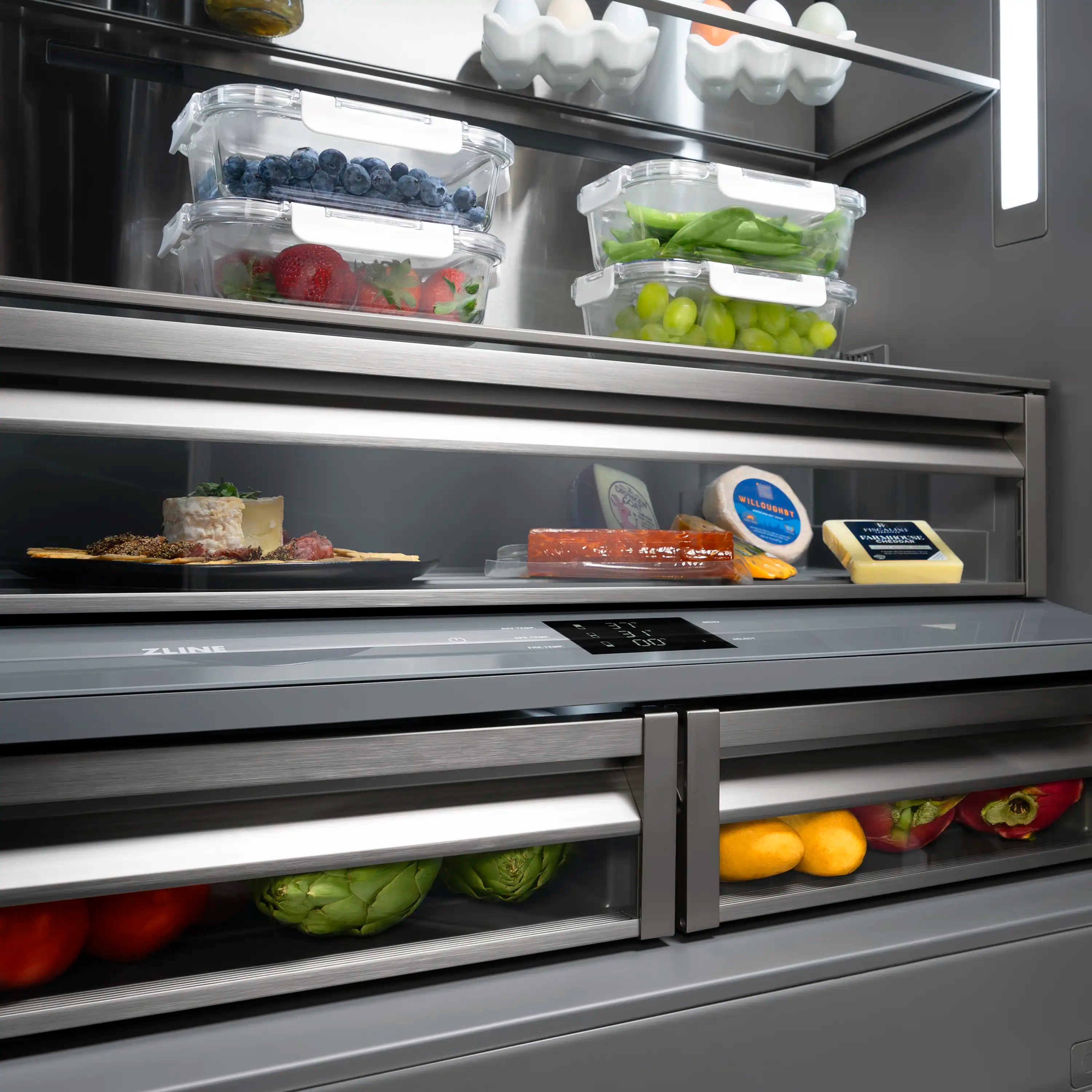 French door refrigerator interior with clear bins of berries, produce, and sauces