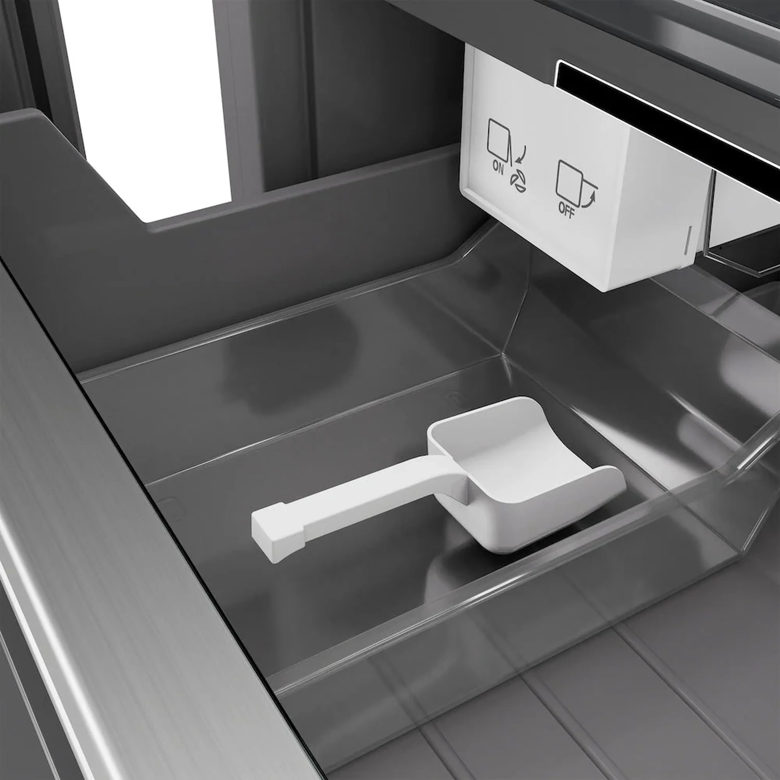 Freezer interior with front ice bin pull-out and built-in on/off controls