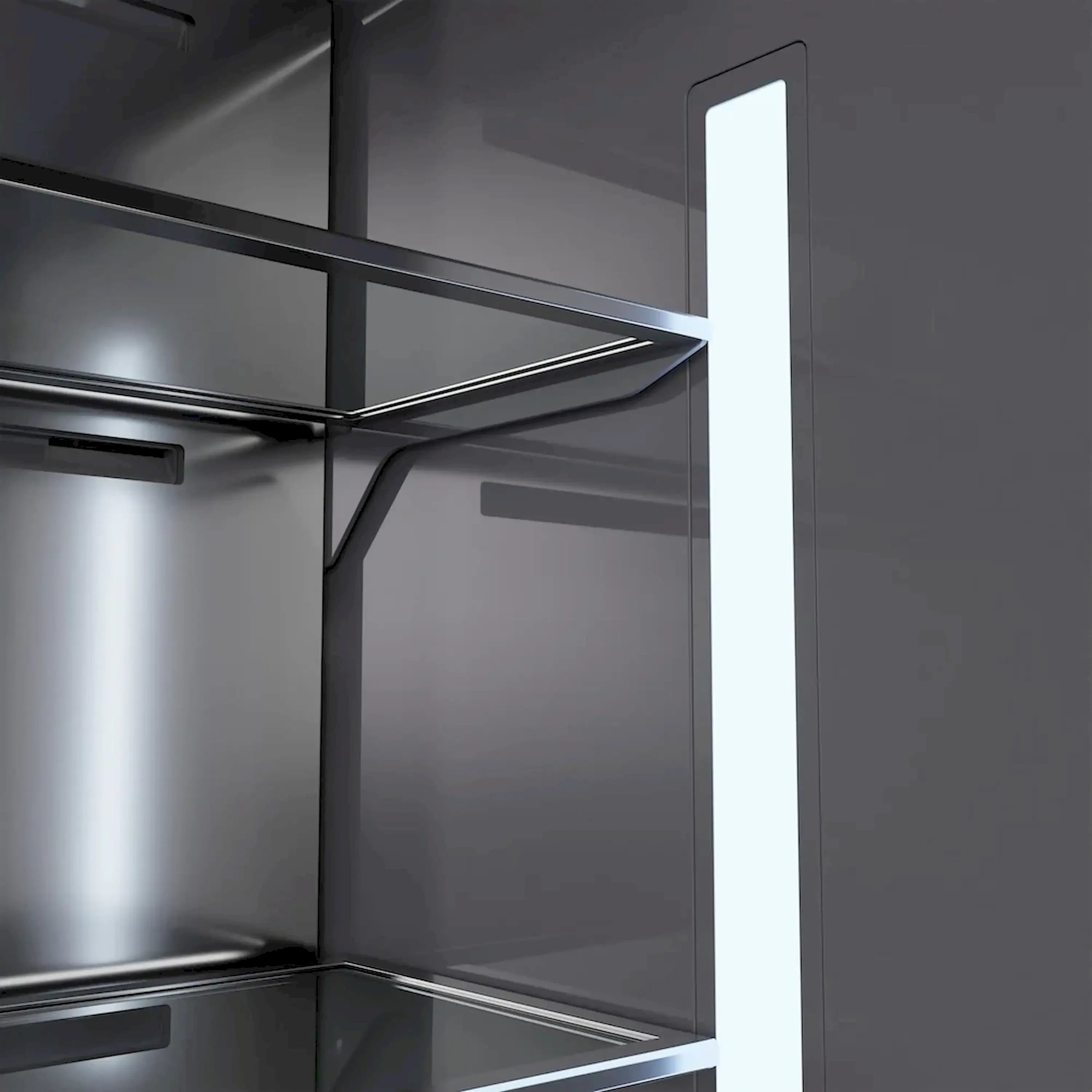 Bottom freezer interior with bright light bar, metal shelves, and drawer tracks