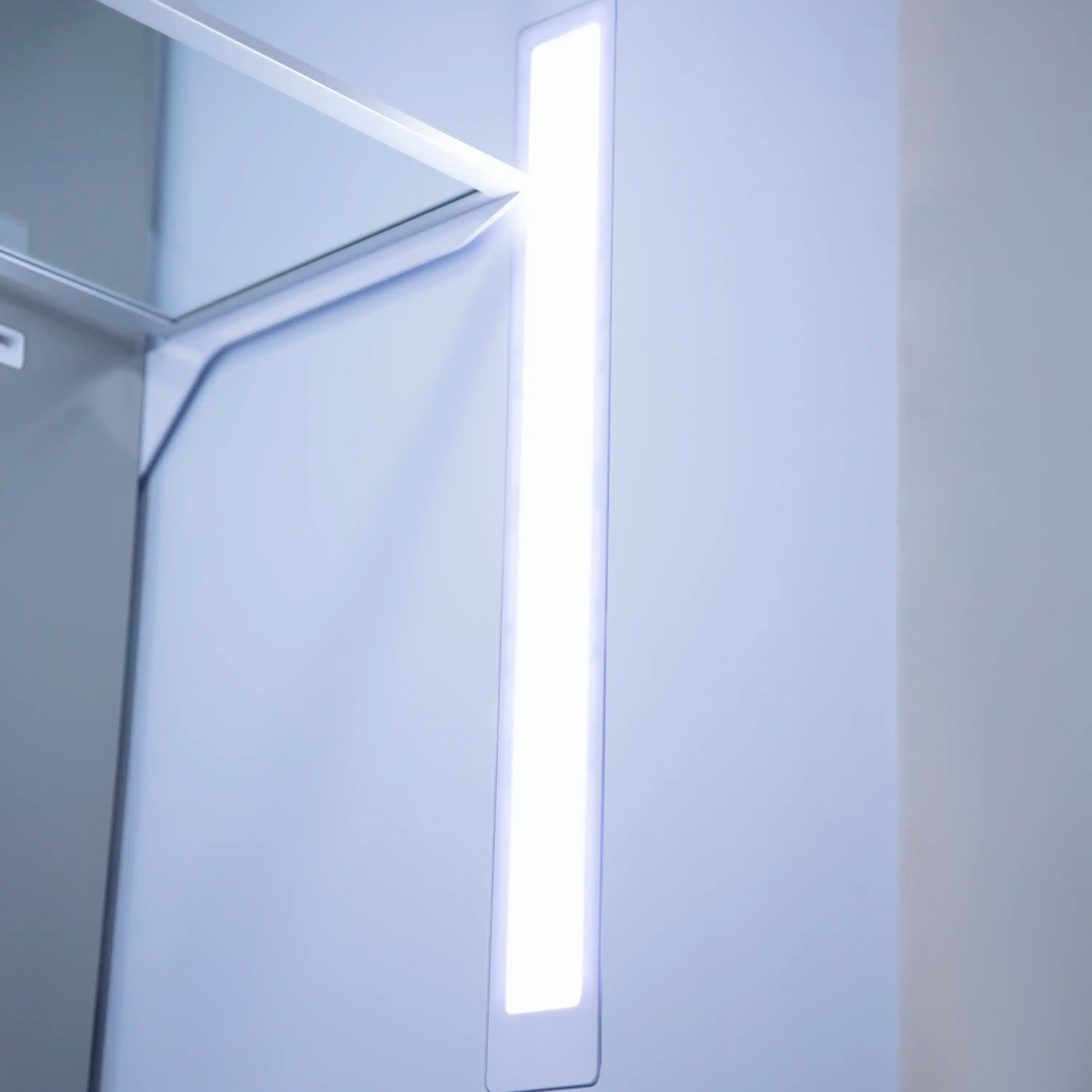 White bottom freezer refrigerator door with built-in handle and interior light