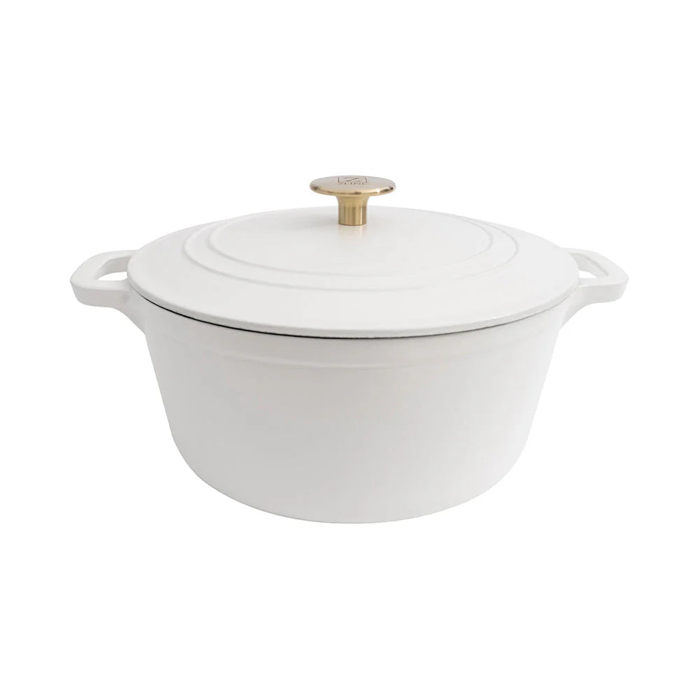 White matte enameled cast iron covered pot with gold knob and loop handles