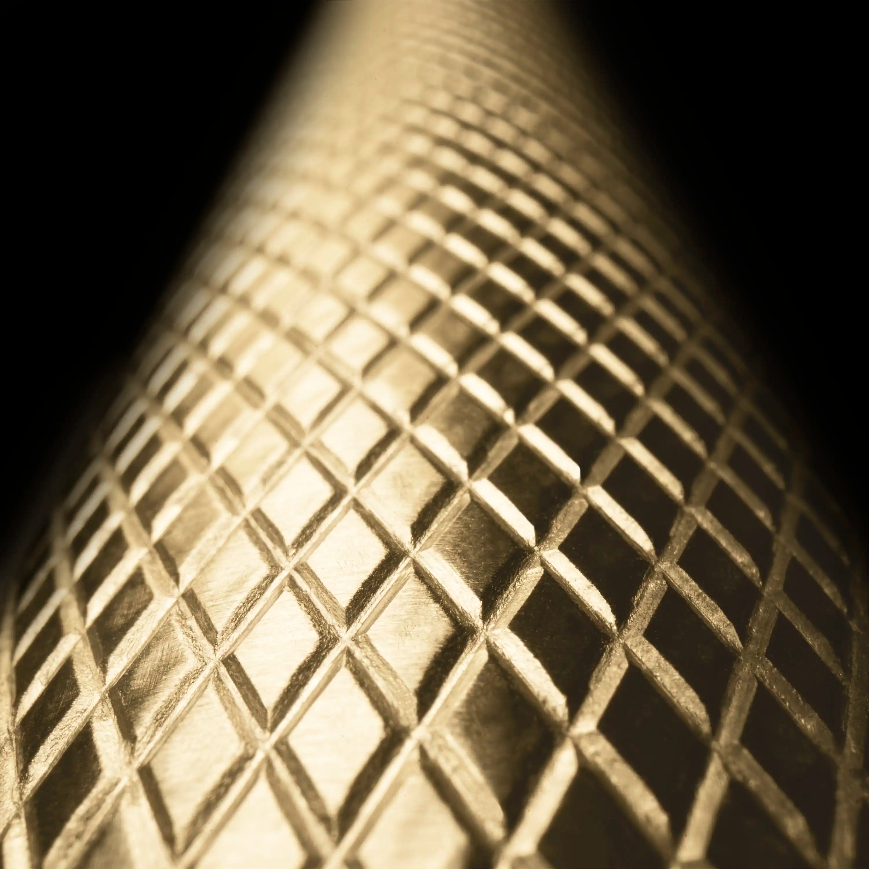 Close-up of bronze metallic diamond-pattern metal mesh detail