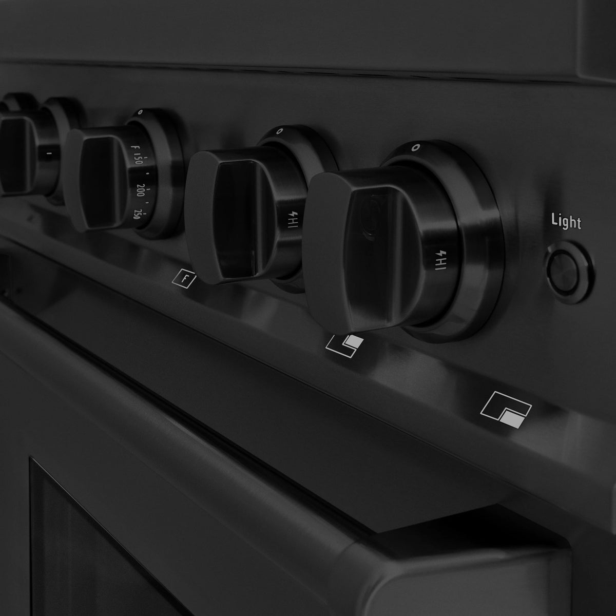 Black gas range control panel with multiple knobs and 'Light' label