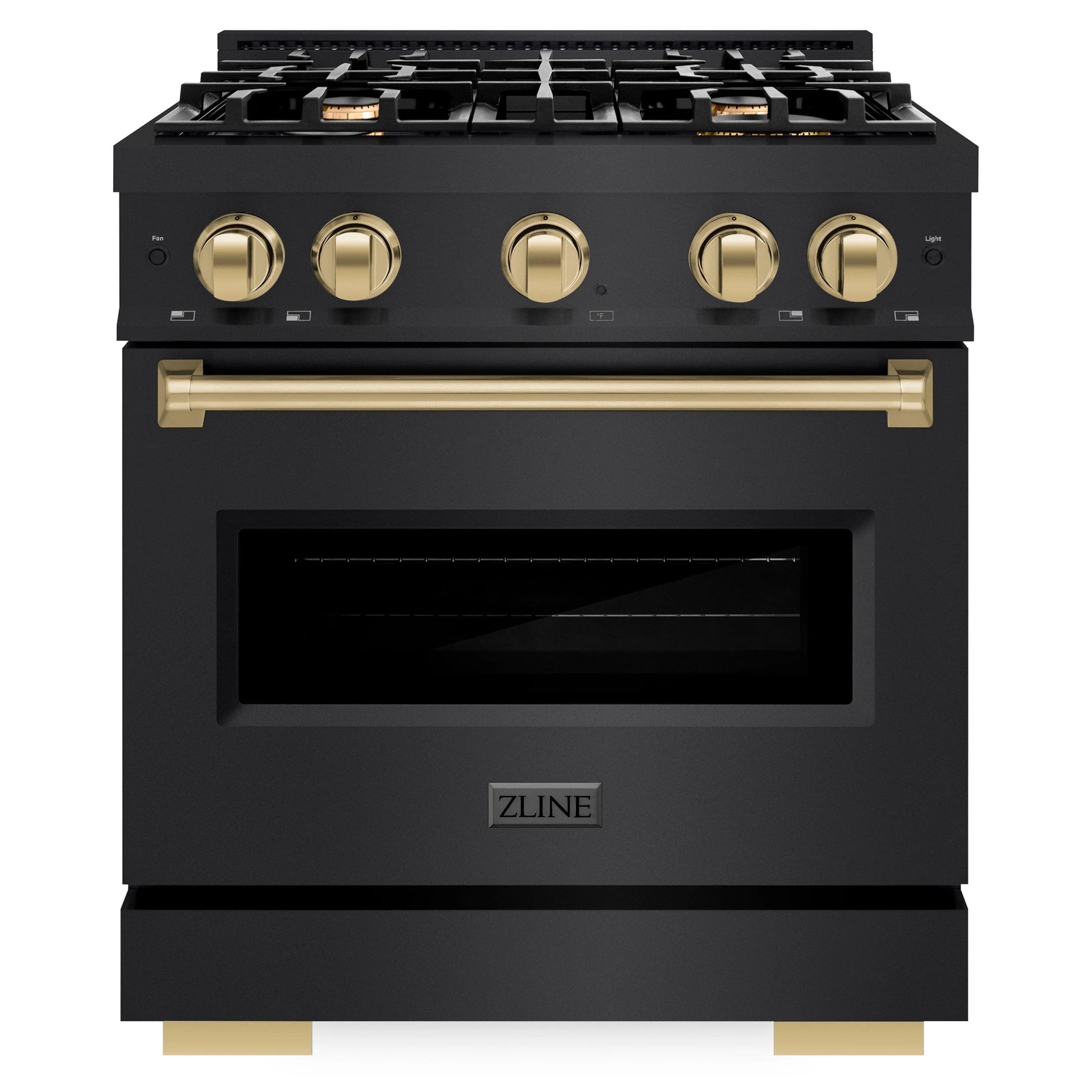 Black dual fuel range with four champagne bronze knobs and gold oven door handle
