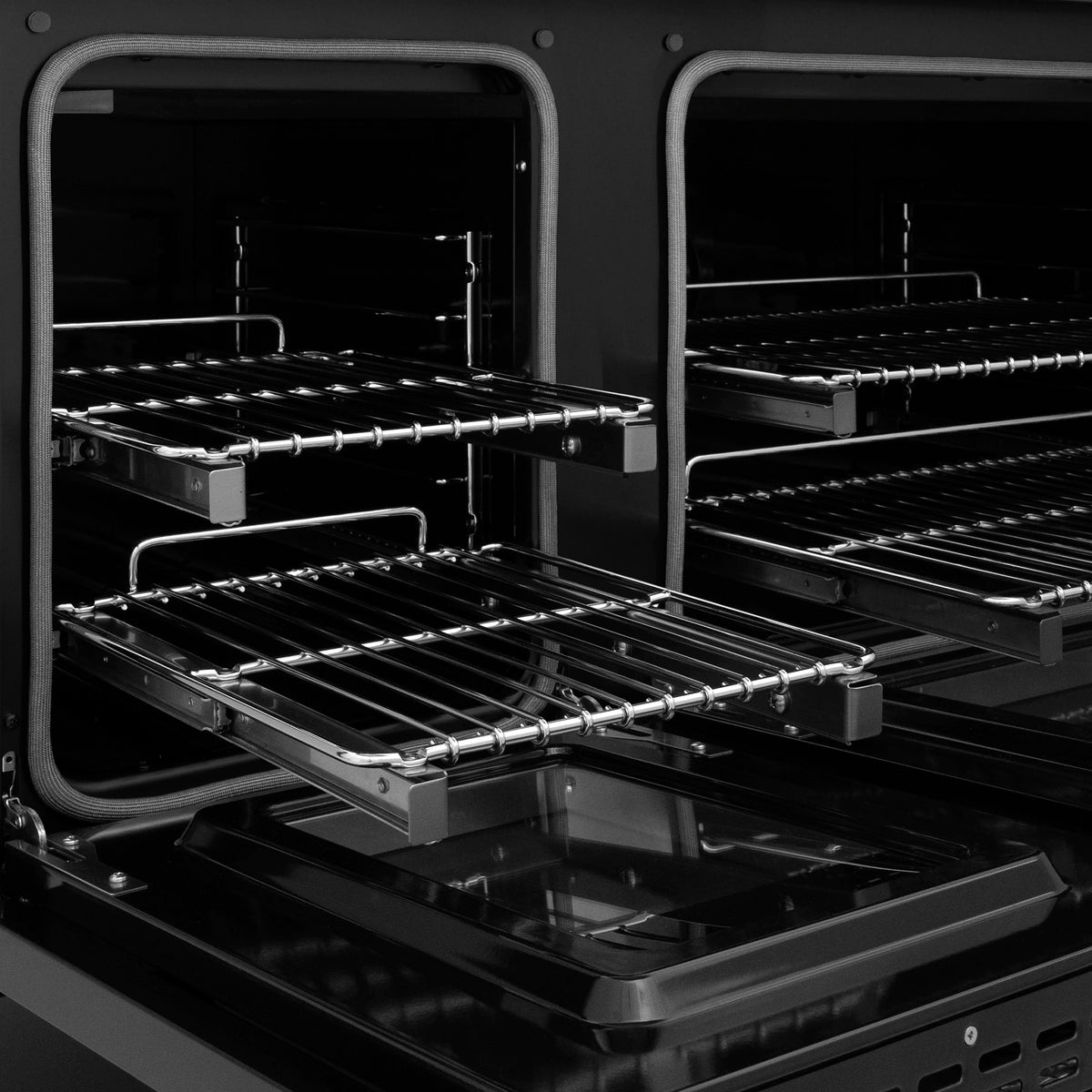Dual fuel range with two oven compartments and chrome rack guides in black stainless steel