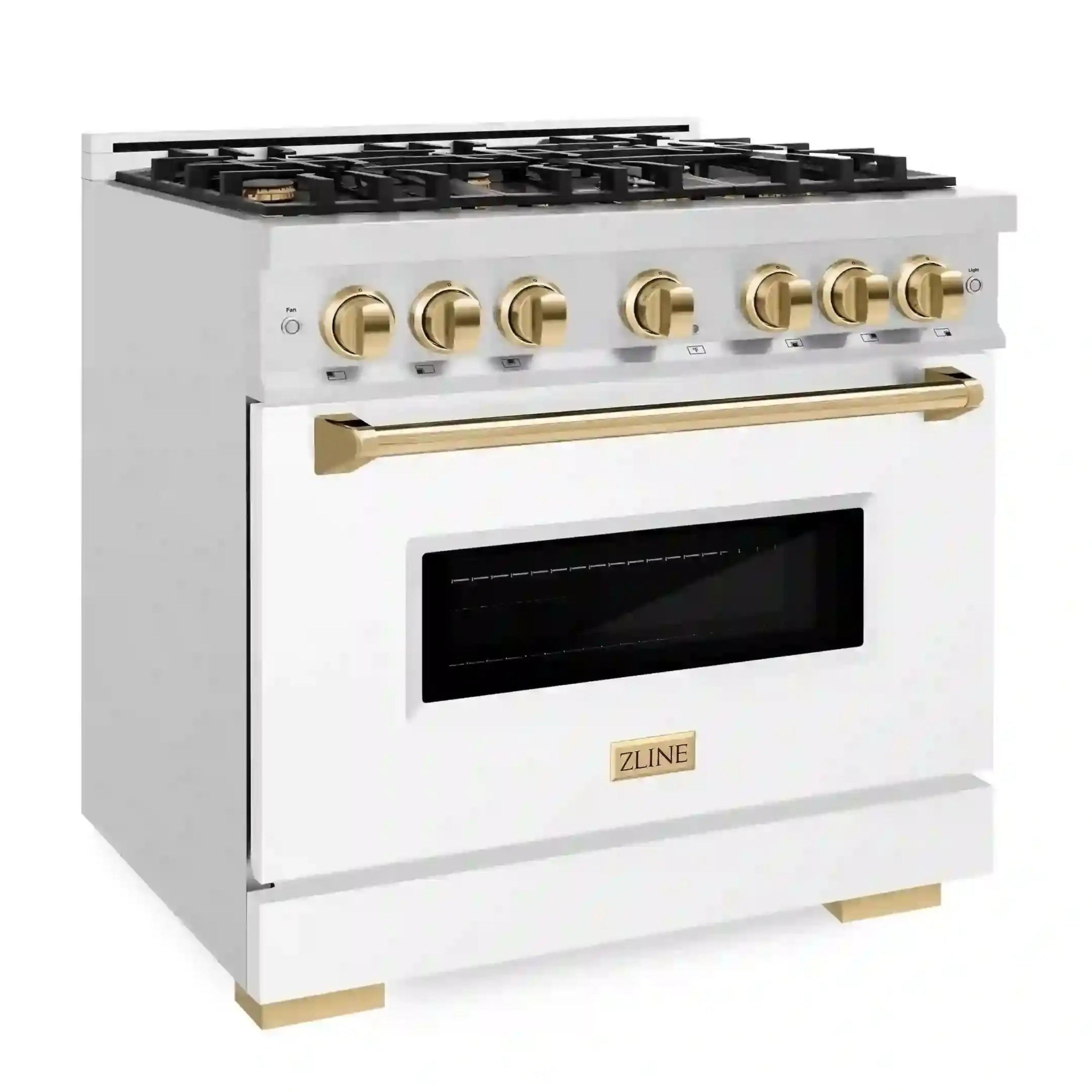 Dual fuel range with black oven window and brass gold control knobs on satin white body