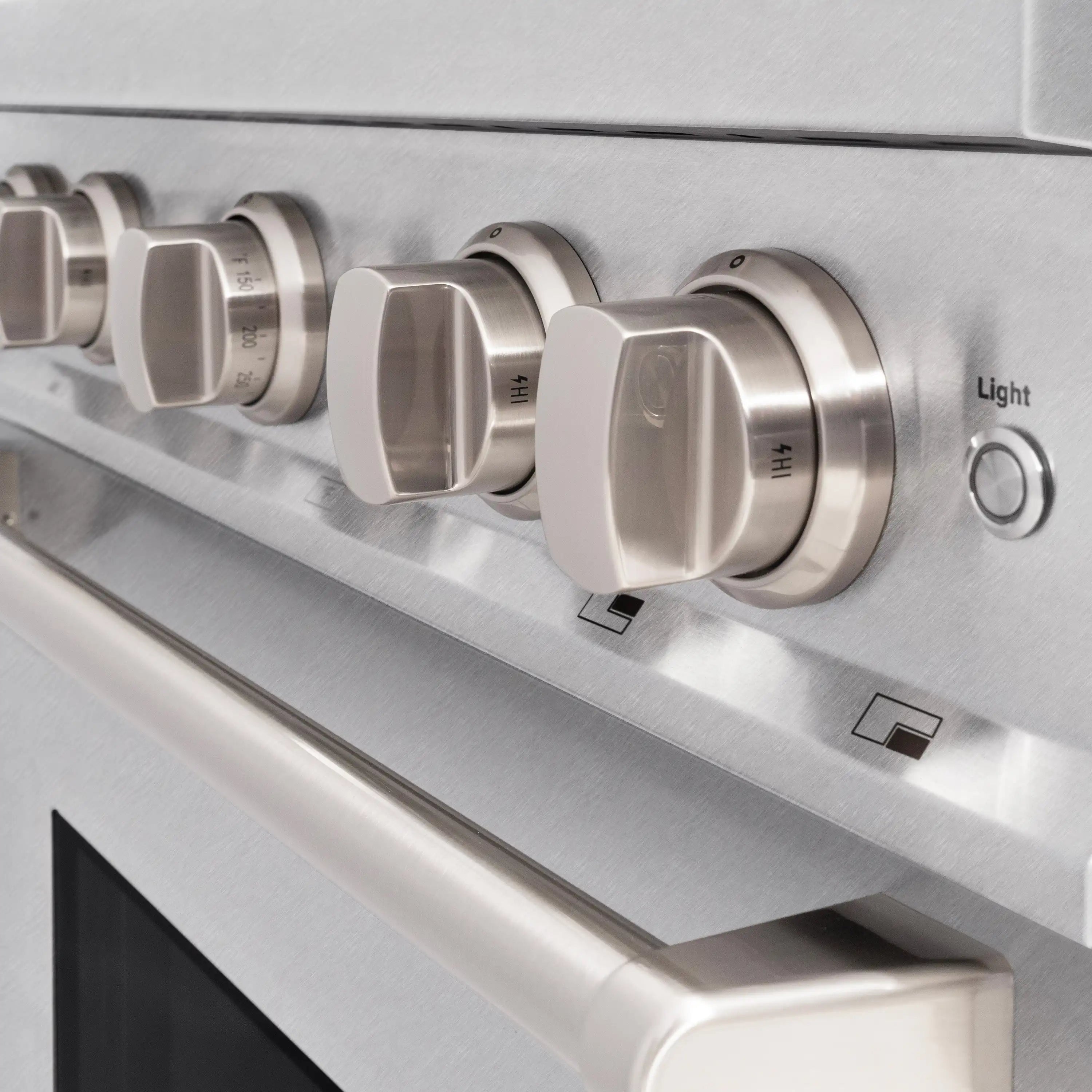 Stainless gas range control panel with multiple burner knobs and light control