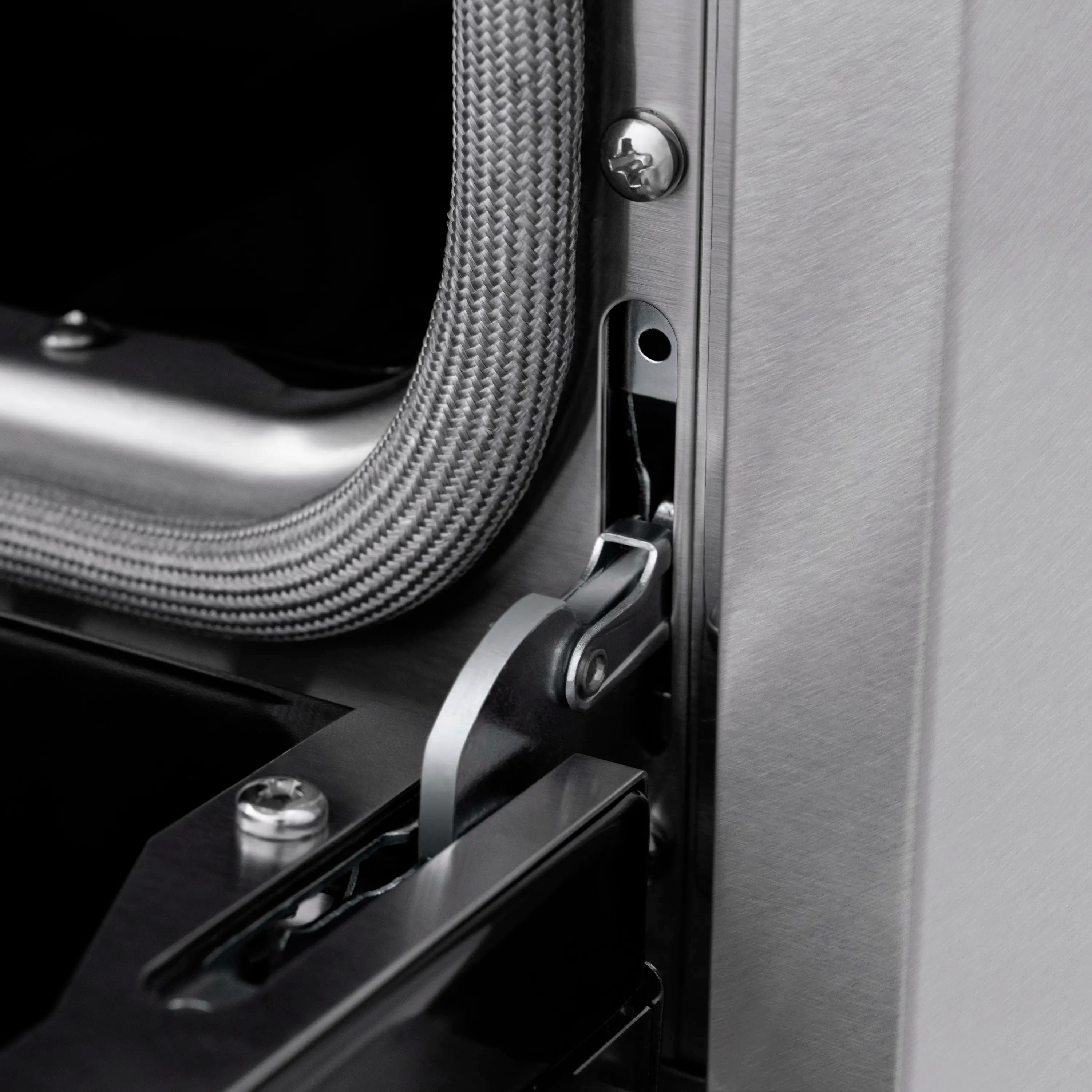 Satin stainless gas range door handle with black matte panel detail
