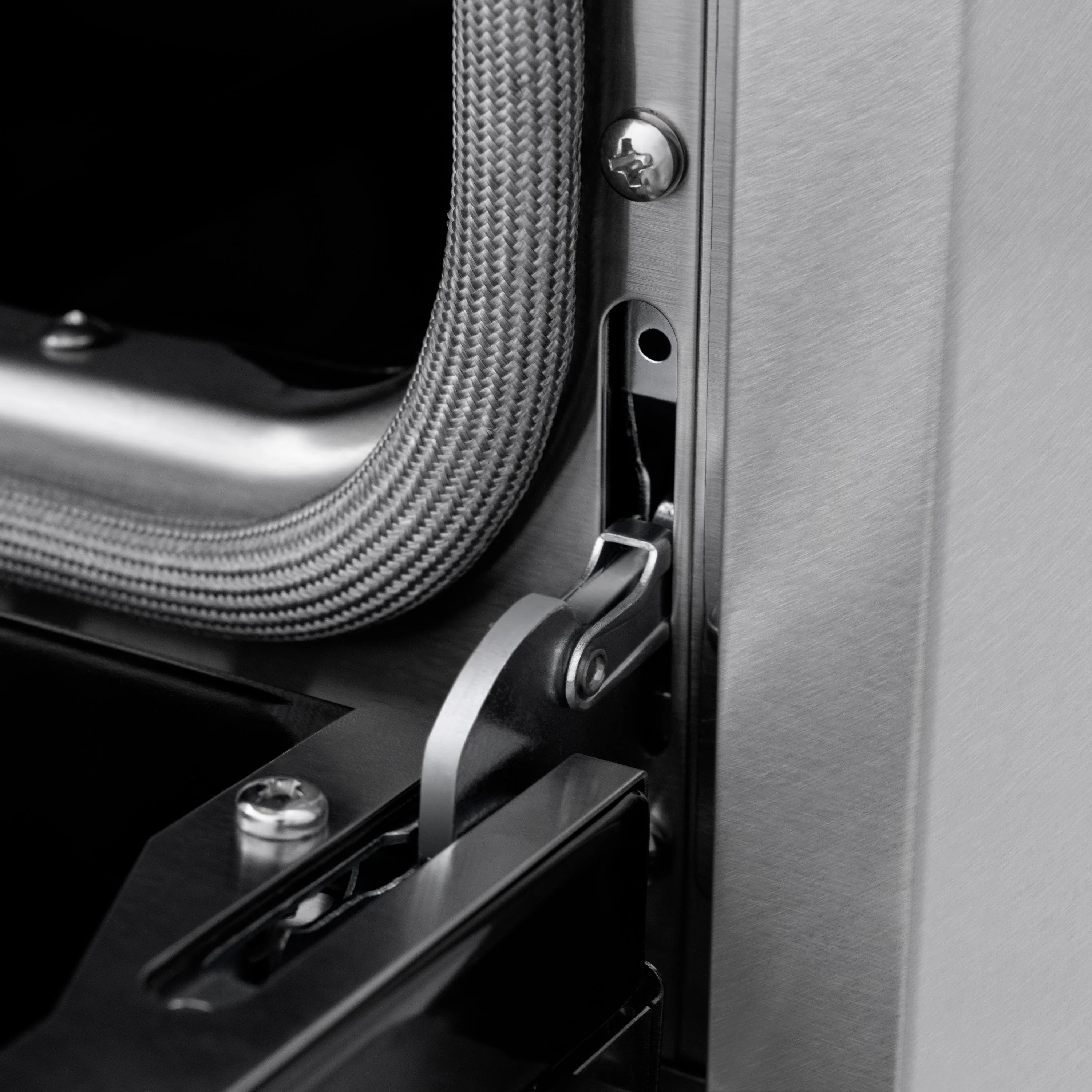 Side control lever and braided gas line fitting on satin stainless gas range