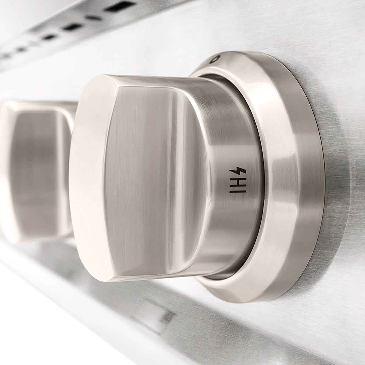 Satin stainless steel control knob with HI marking on gas stovetop