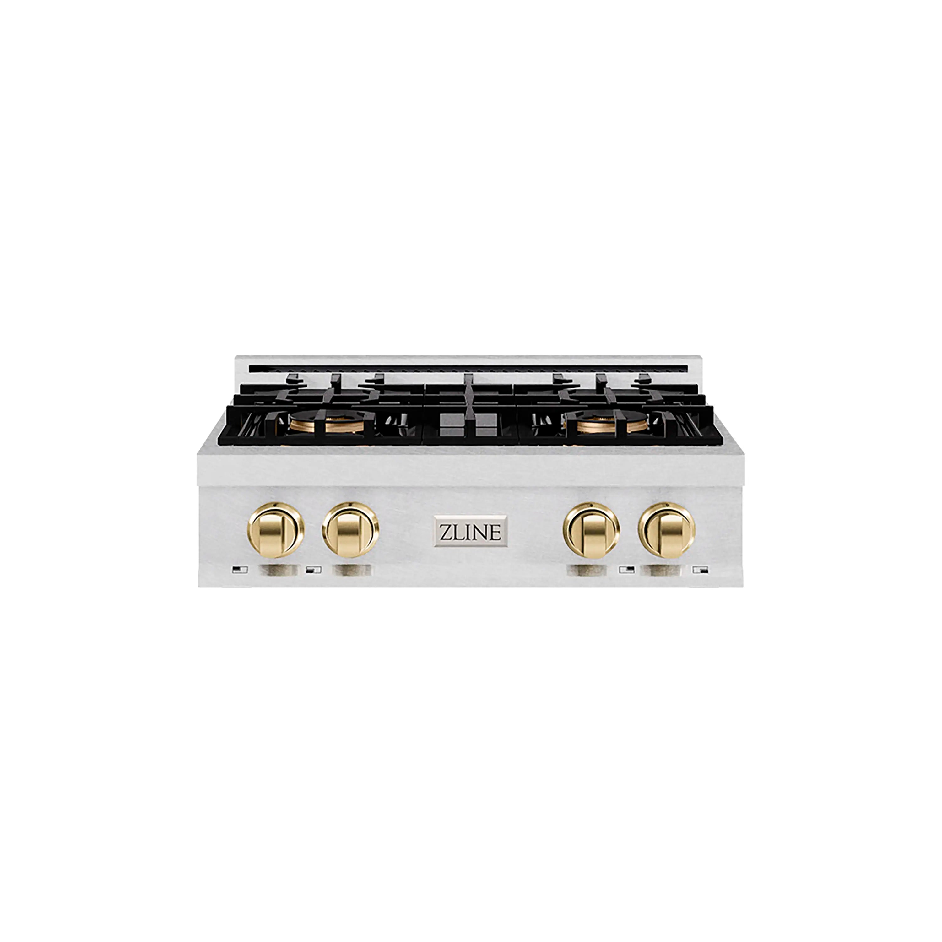 Satin stainless gas cooktop front with four gold knobs and black burner grates