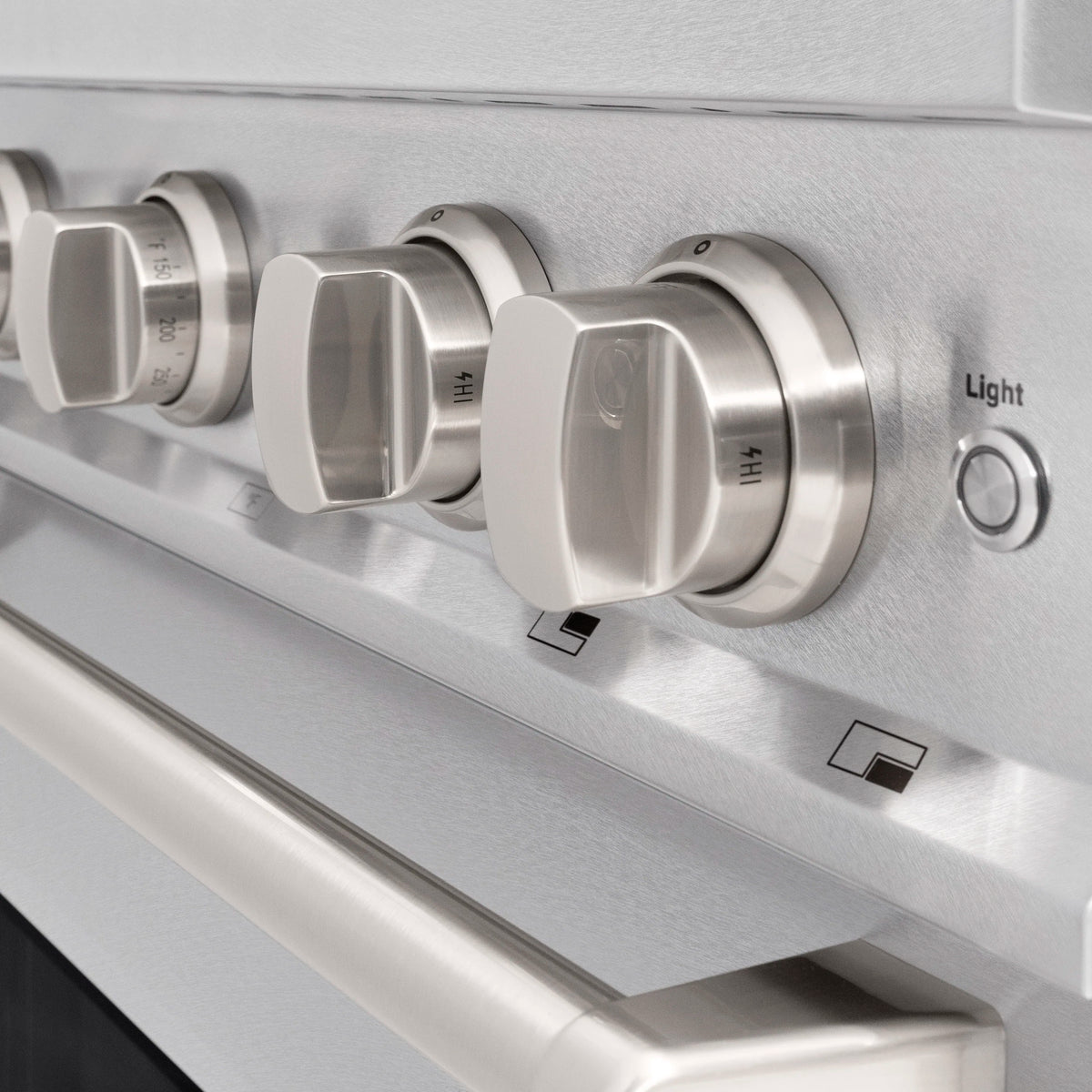 Dual fuel range control knobs on stainless steel front panel