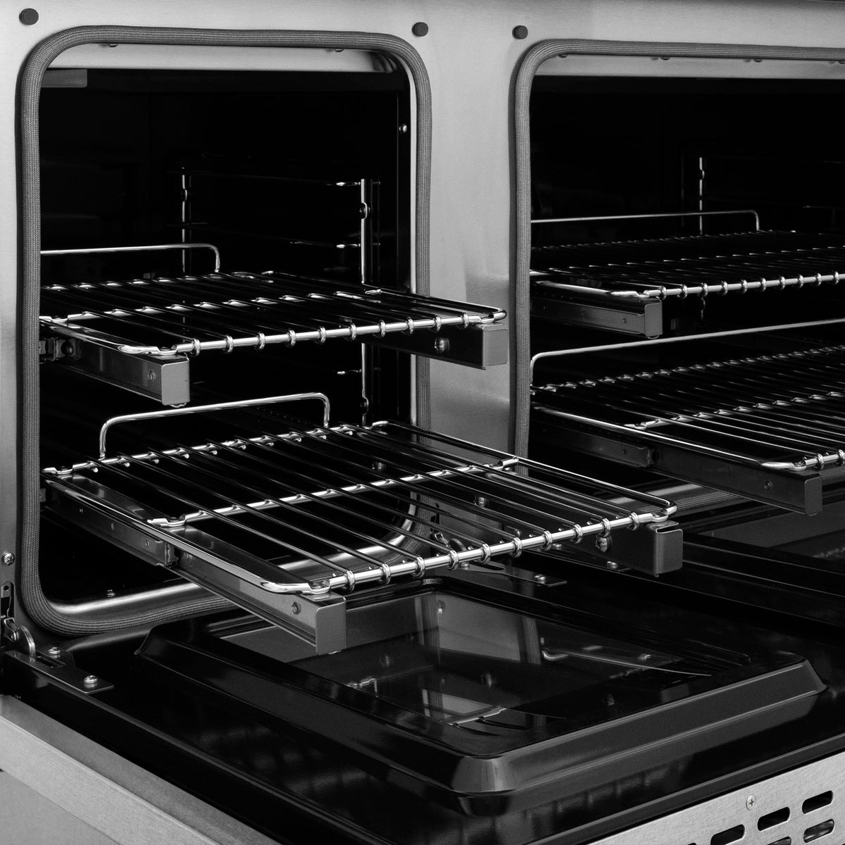 Dual oven interior with open racks and chrome supports