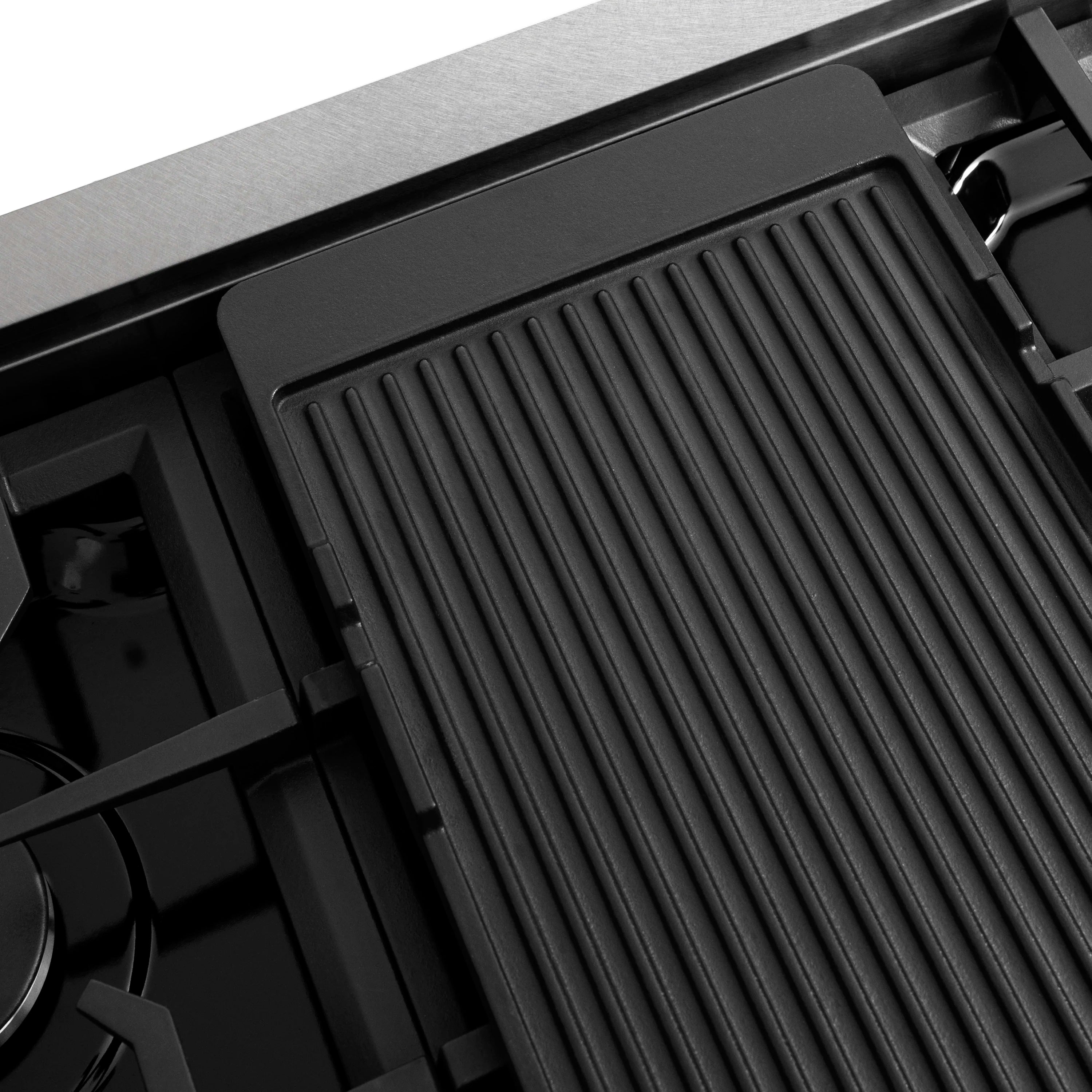 Ridged black griddle cooking surface on a gas stovetop