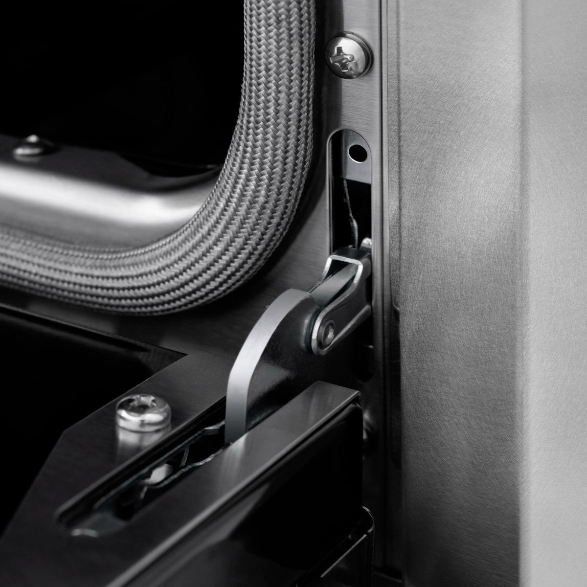 Gas range side detail with metal latch and flexible gas line connection