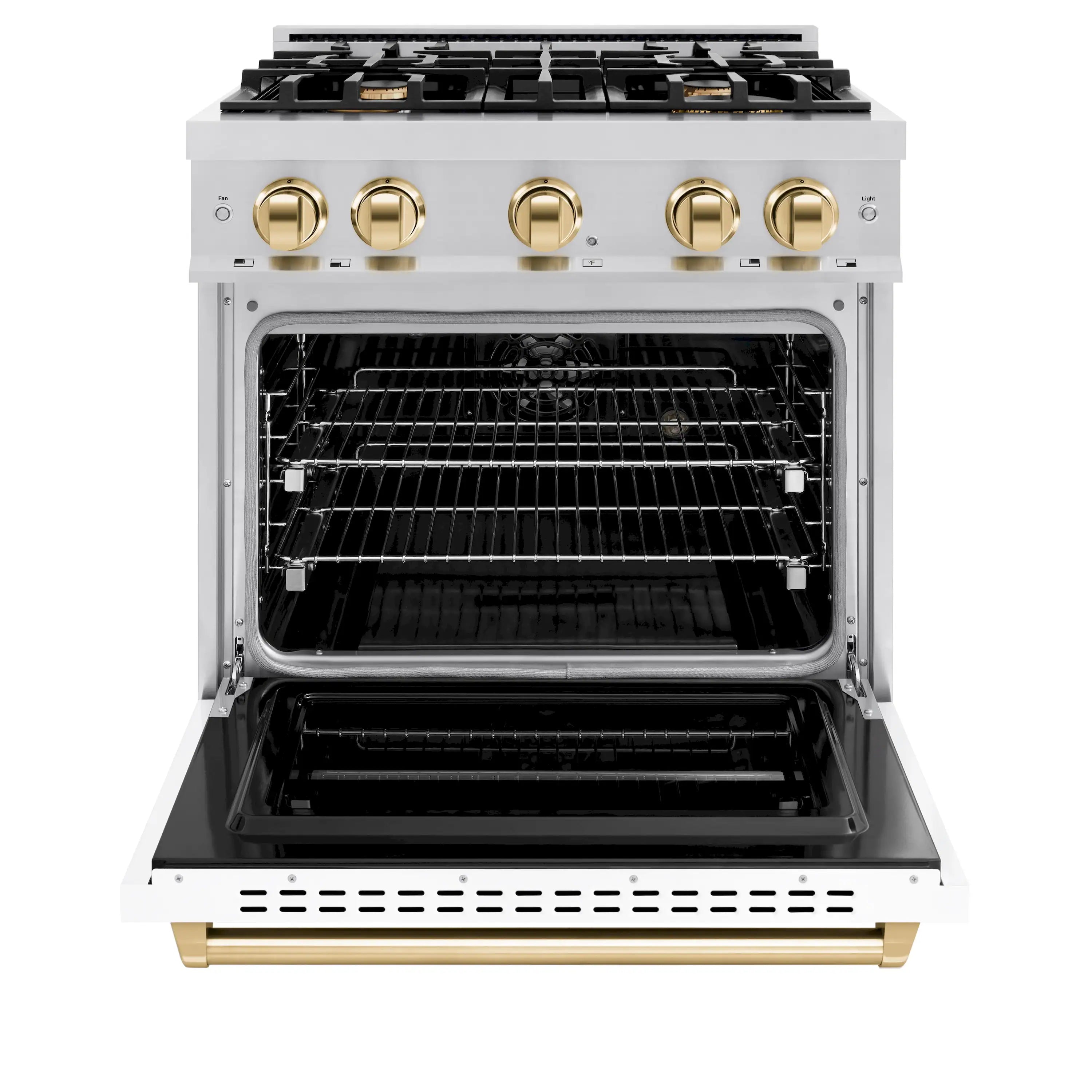 Stainless dual-fuel range with open oven, racks inside, and polished gold front knobs
