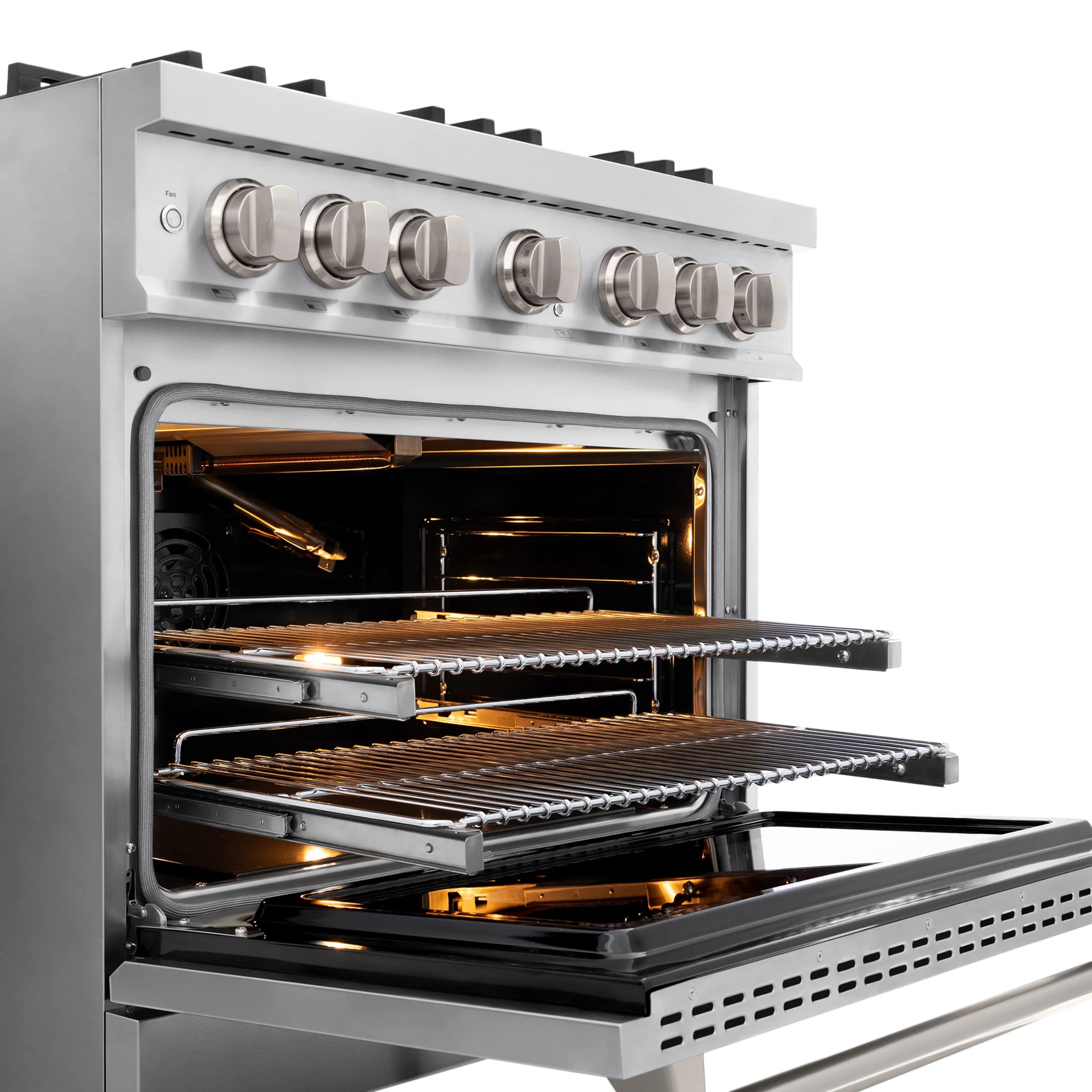 Stainless steel oven interior with convection heating elements and illuminated broiler area