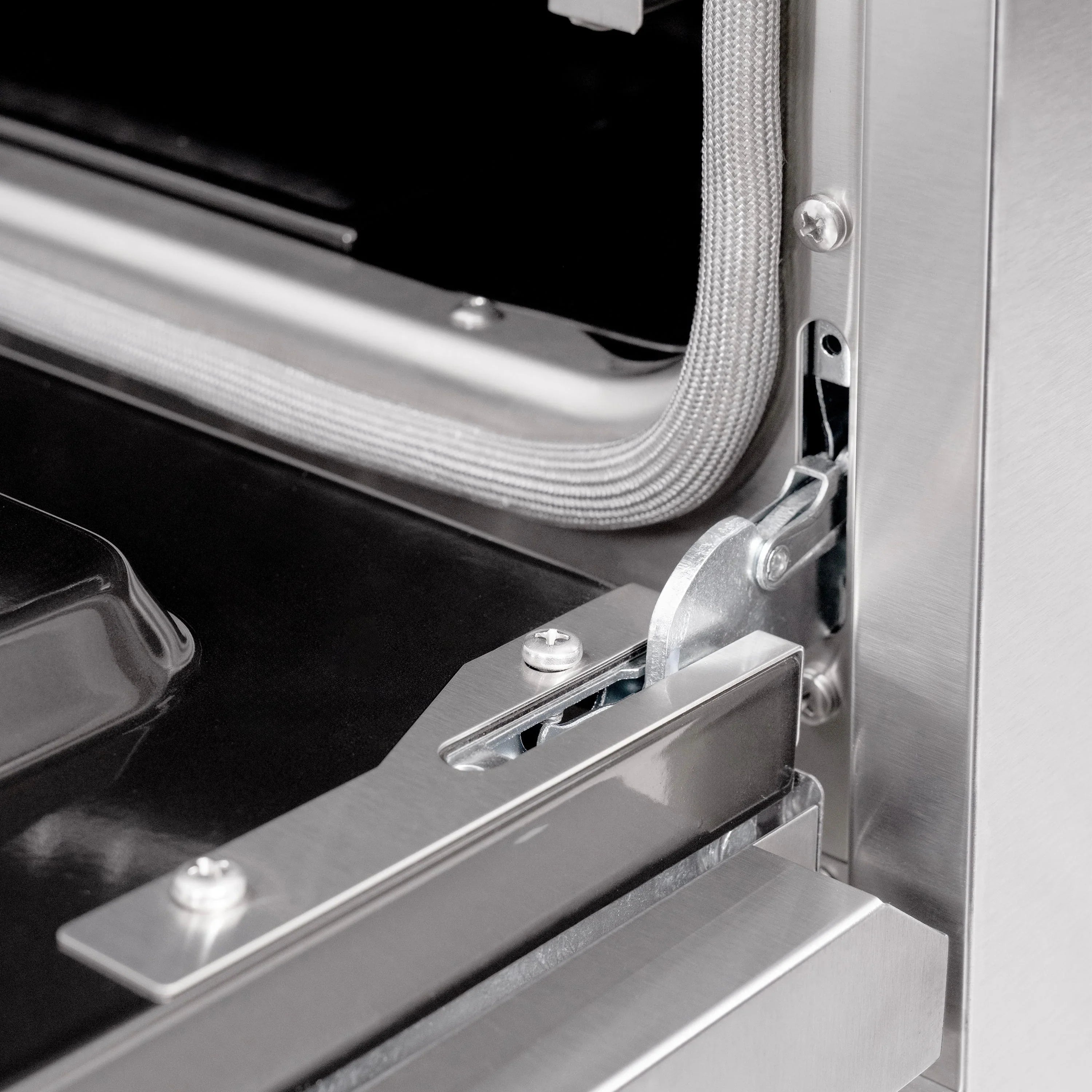 Gas range metal door hardware with curved handle and mounting bracket
