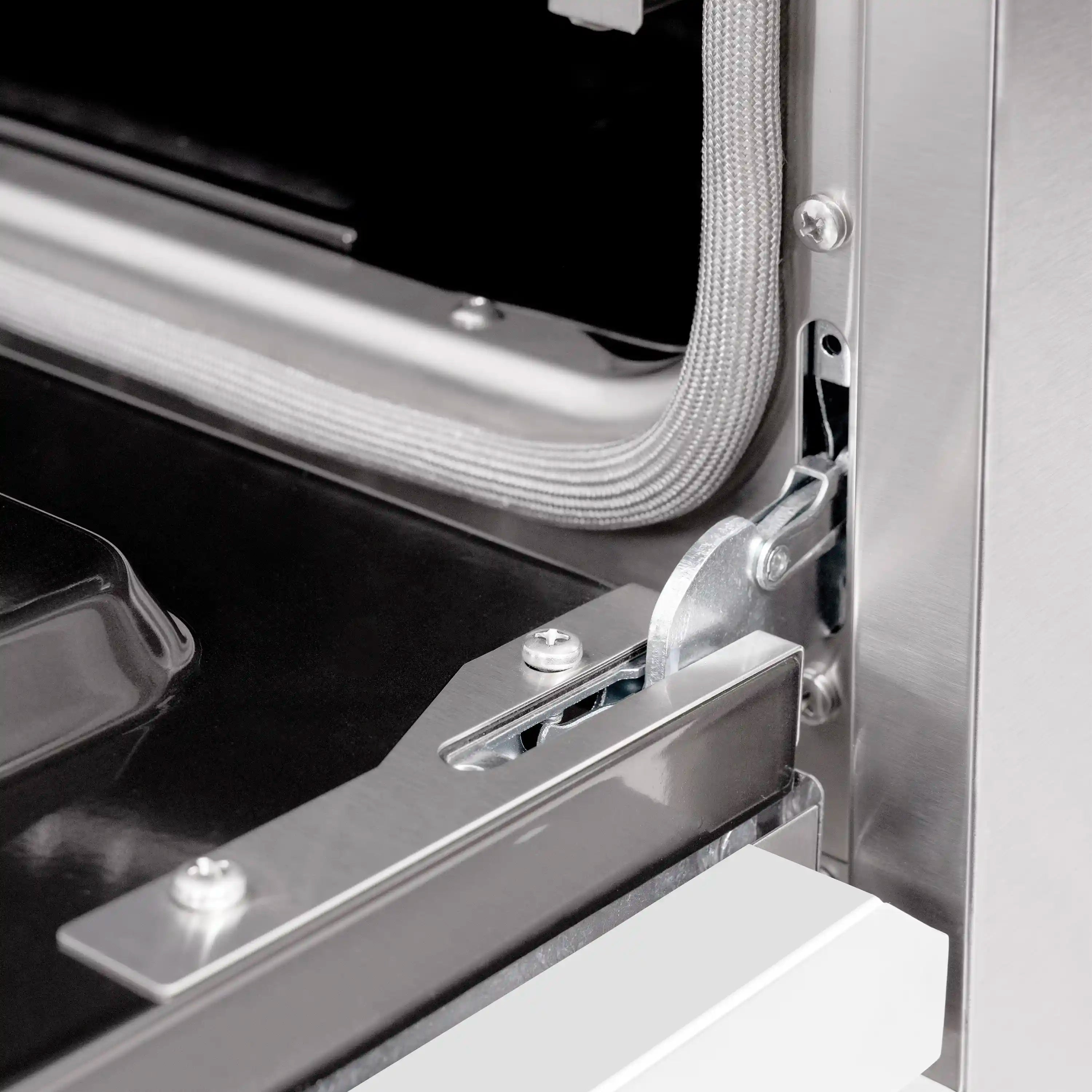 Stainless oven door hinge bracket and flexible seal connection
