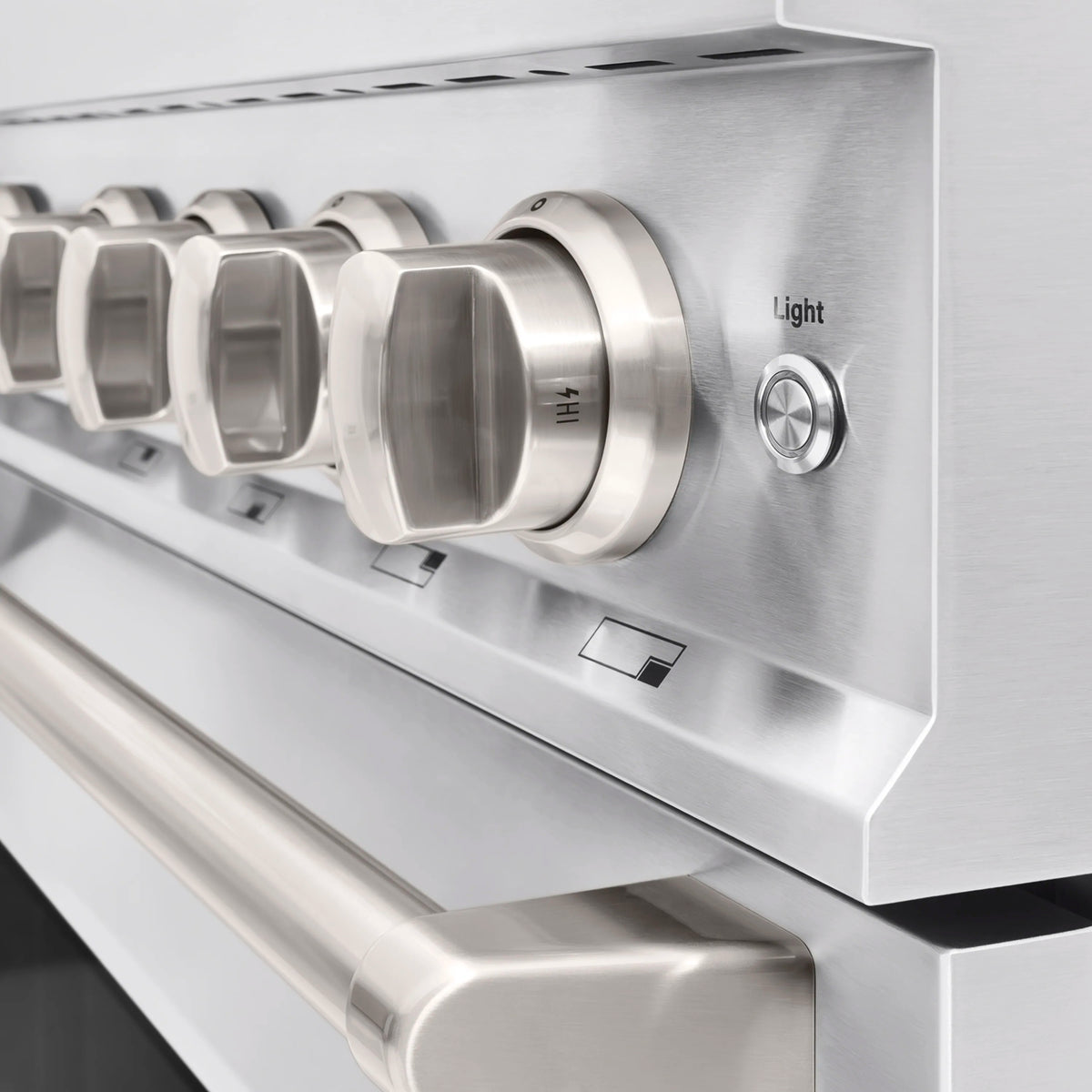 Stainless control panel with multiple silver knobs and a light button
