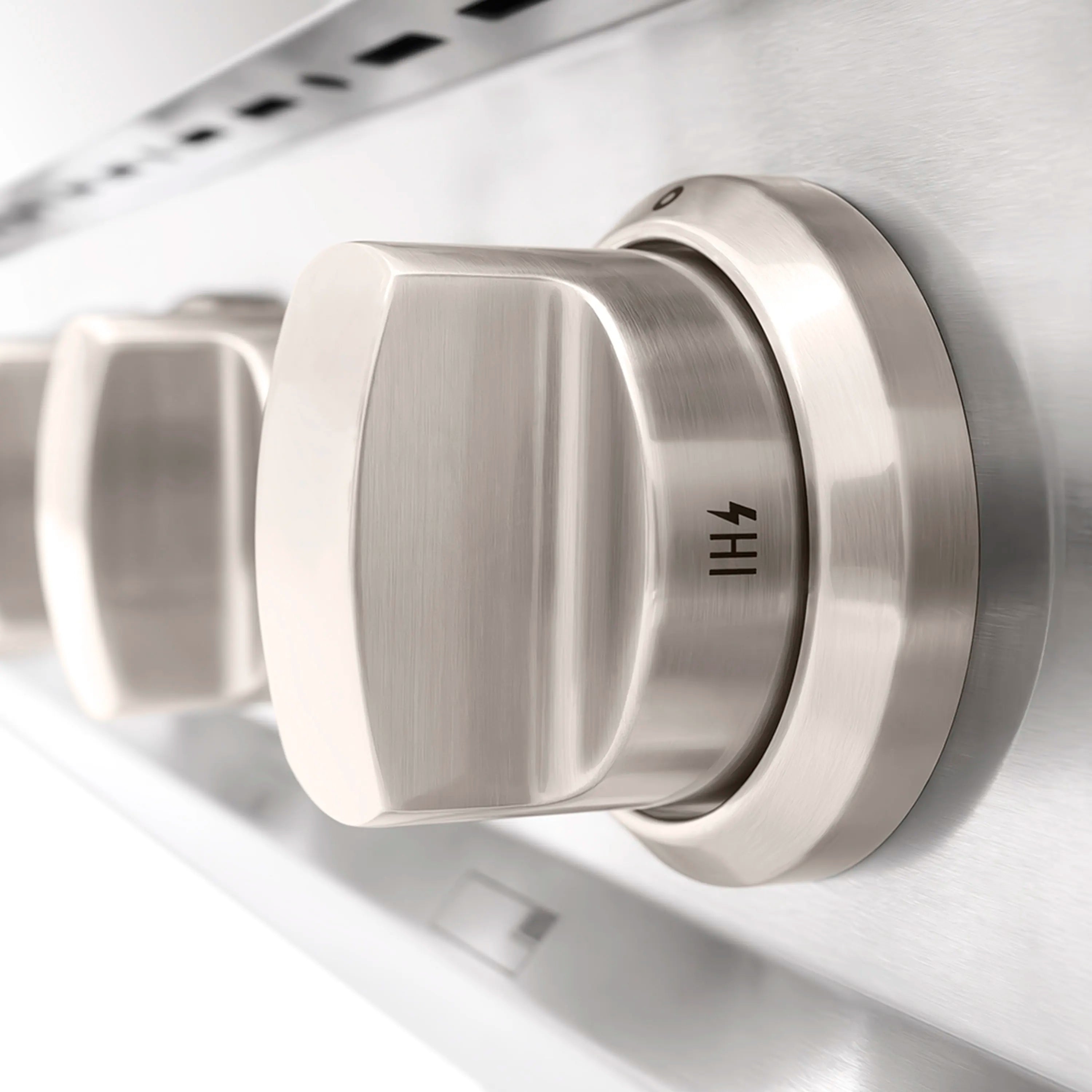 Stainless steel control knob on a gas cooktop