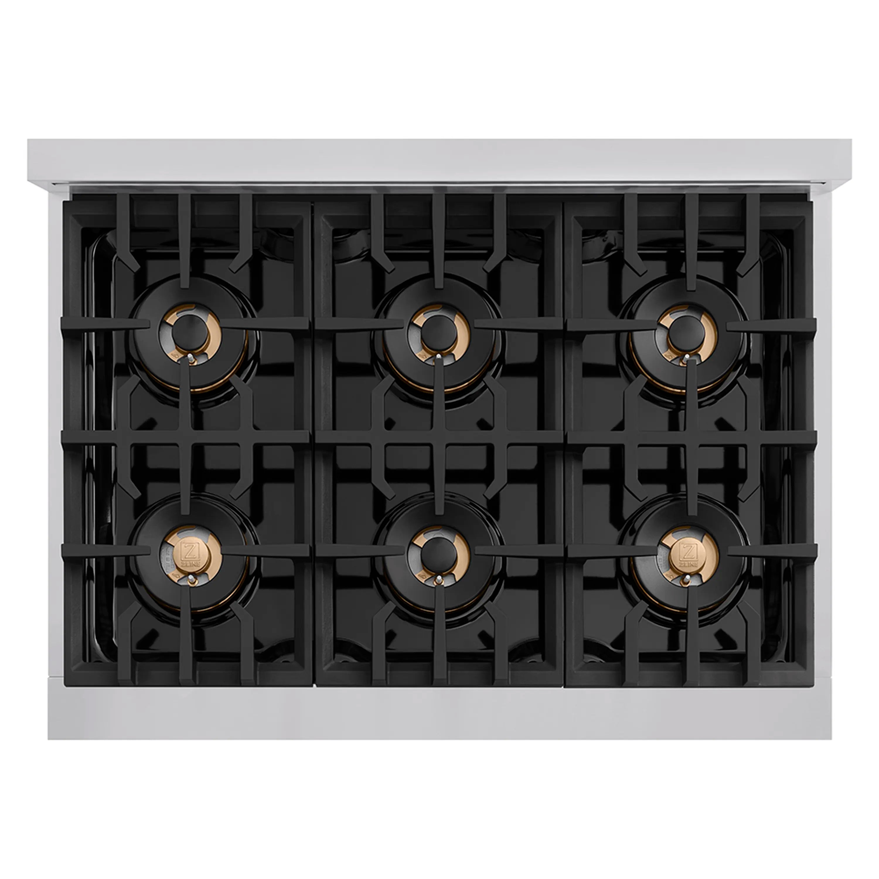 Underside view of six-burner layout inside a gas cooktop