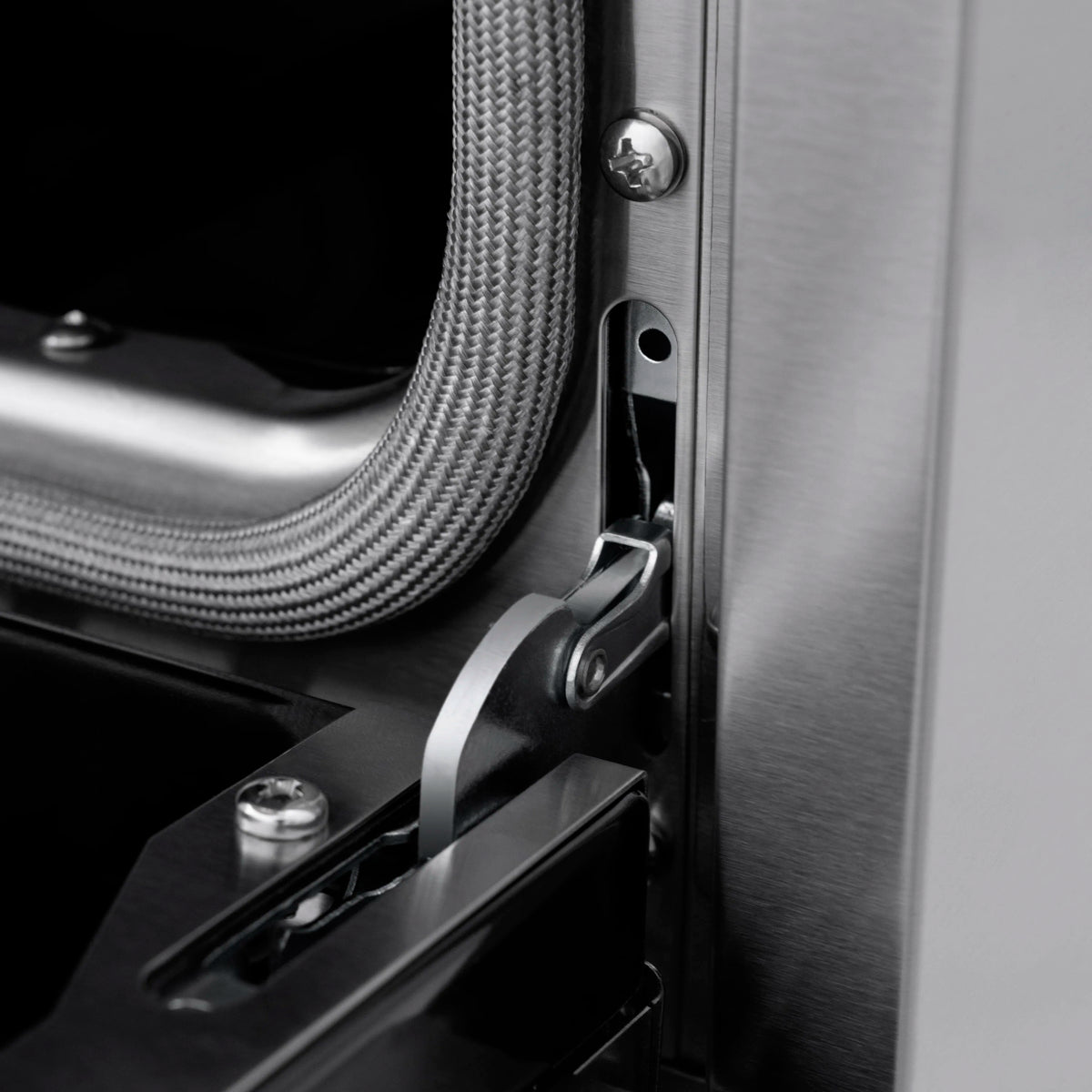 Gas range back panel with flexible gas line and metal connector