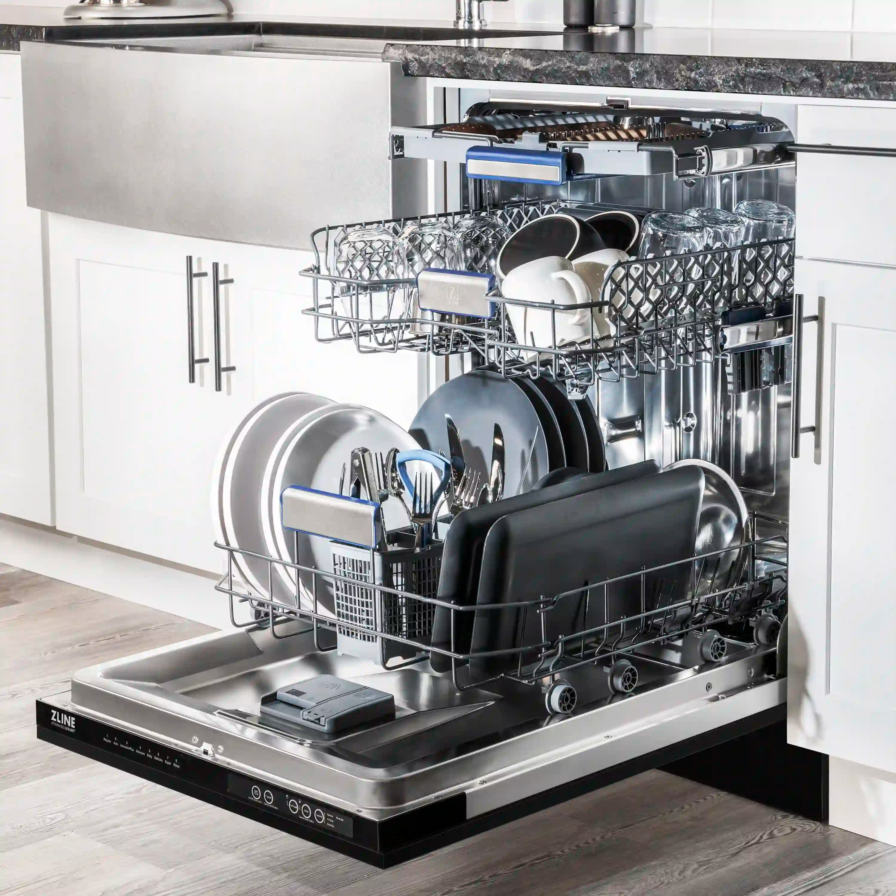 Built-in dishwasher open with racks and dishes on interior